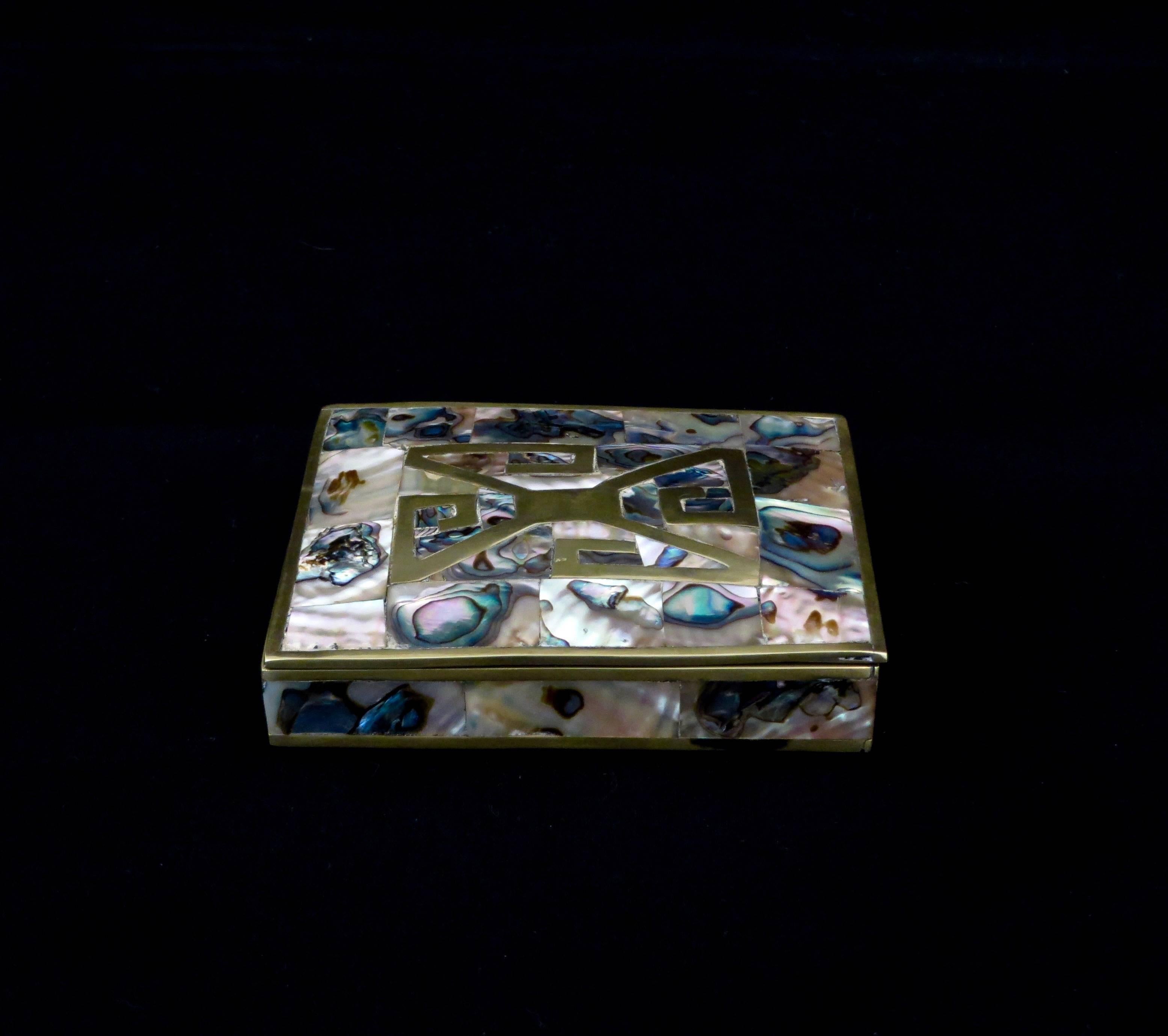 A sterling and brass finely crafter box with abalone inlay and brass abstract form inlay box from Taxco, Mexico. 
Pavilion is pleased to present this item and several other boxes of this style in more listings.