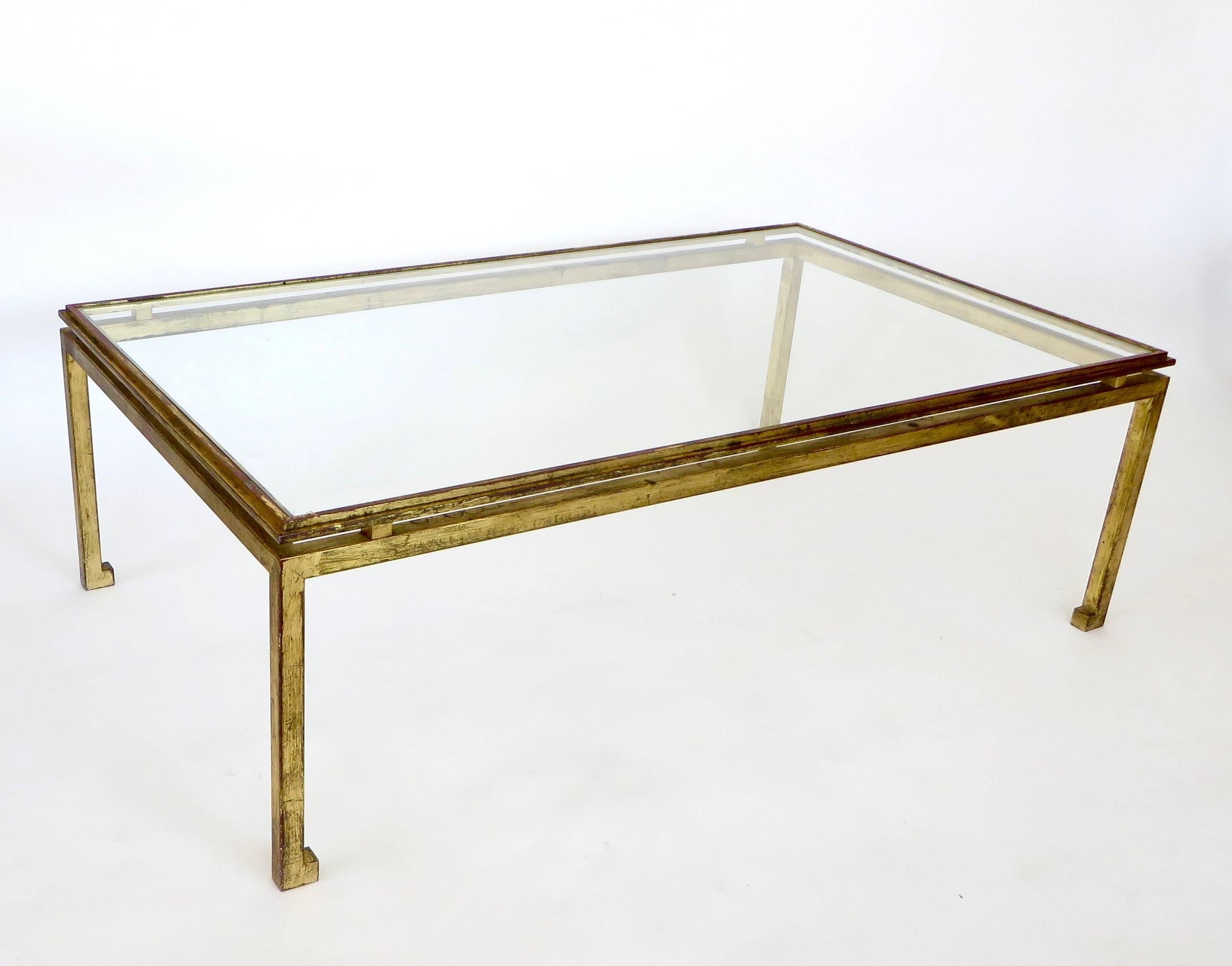 Maison Ramsay superb patina gilded wrought iron, rectangular coffee table with a St. Gobain glass plateau. See detail photo with St. Gobain glass insignia. The legs are solid iron, 1 inch thick not tubular and very heavy. Measure: The foot is 1.75