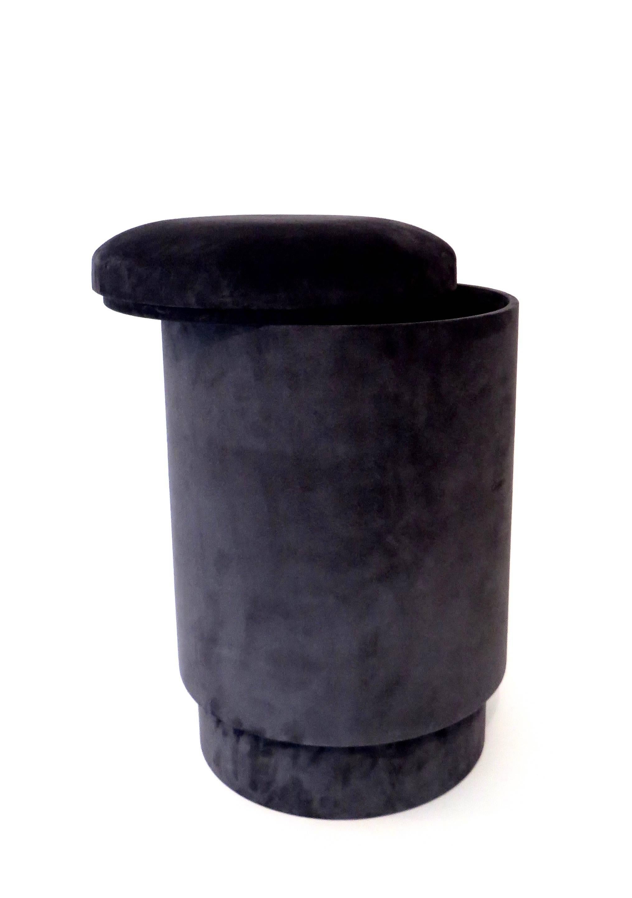 A Michael Verheyden pouf or tabou or stool with storage shown covered in dark gray suede. 
Pouf with storage space is covered in the most beautiful suede. Lined with black suede inside. 
Michael Verheyden is a Belgium based designer creating home