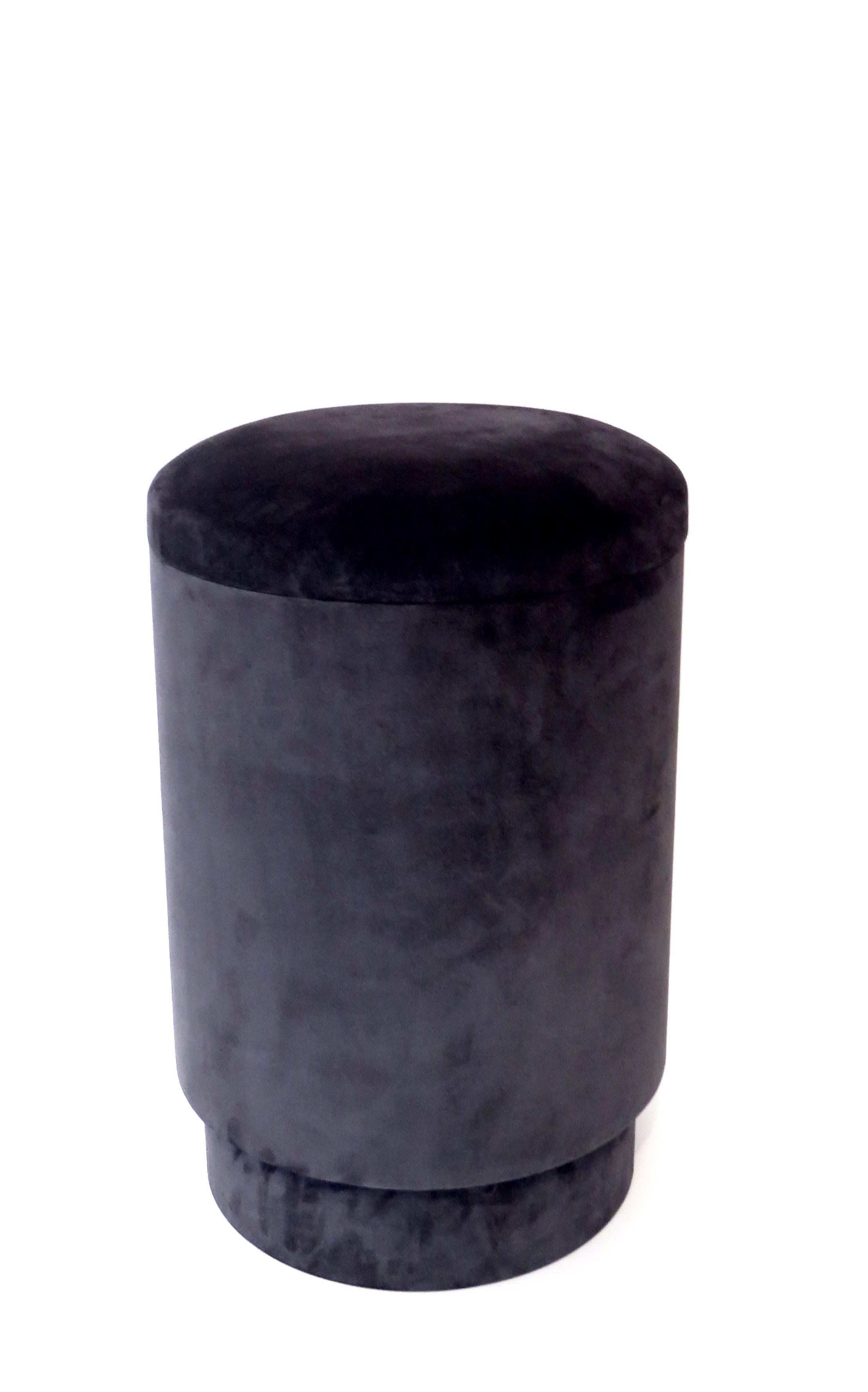 A Michael Verheyden pouf or tabou or stool with storage available in various colors. 
Pouf with storage space is covered in the most beautiful suede. Covered in black suede inside. 
Michael Verheyden is a Belgium based designer creating home