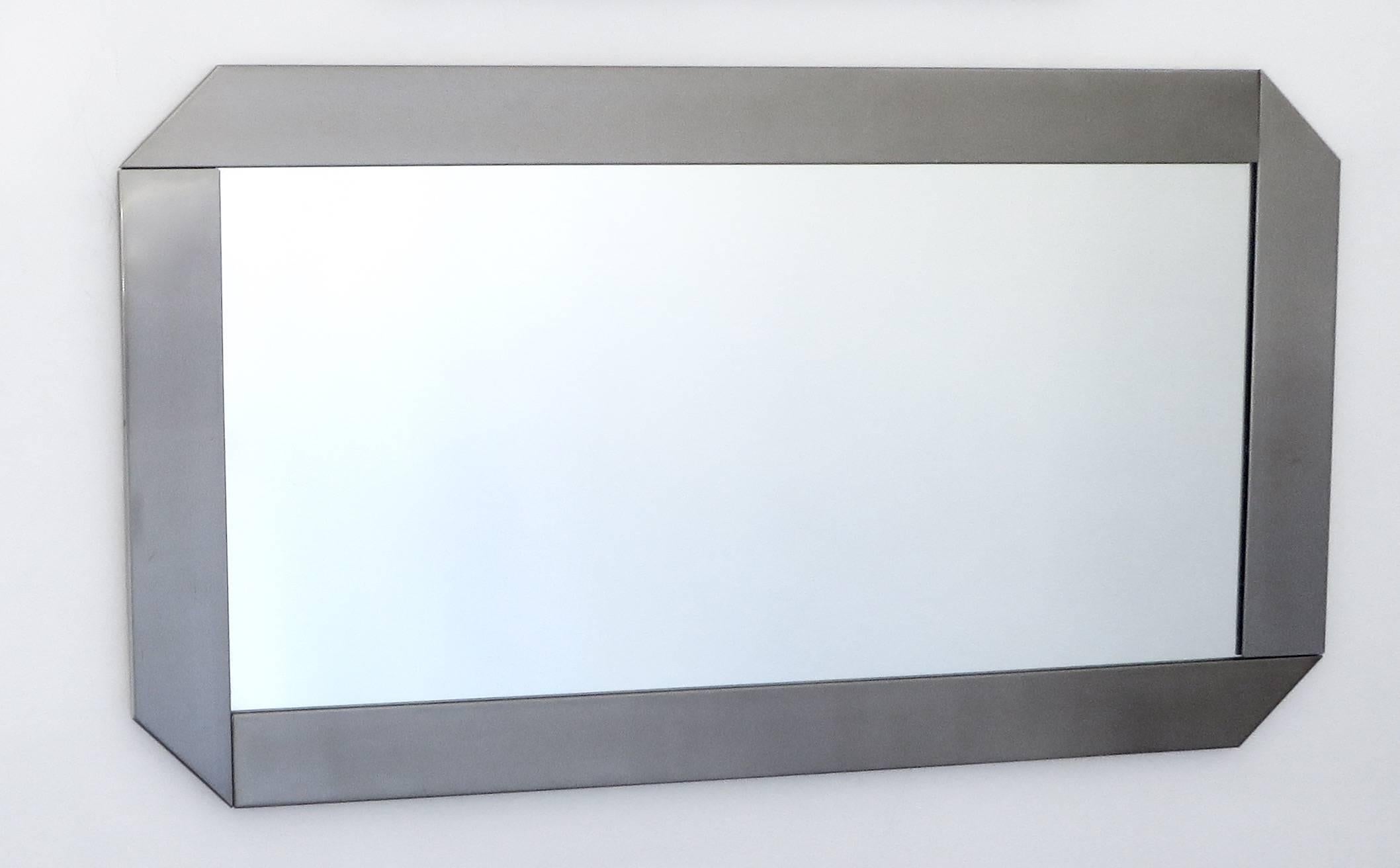 Two brushed steel mirrors by Valenti and are in the catalog Valenti.
Interesting detail on the corners as the steel appears to be folded.
These mirrors are made to be hung either horizontal as shown or vertical.
Italian, circa 1970.
Will