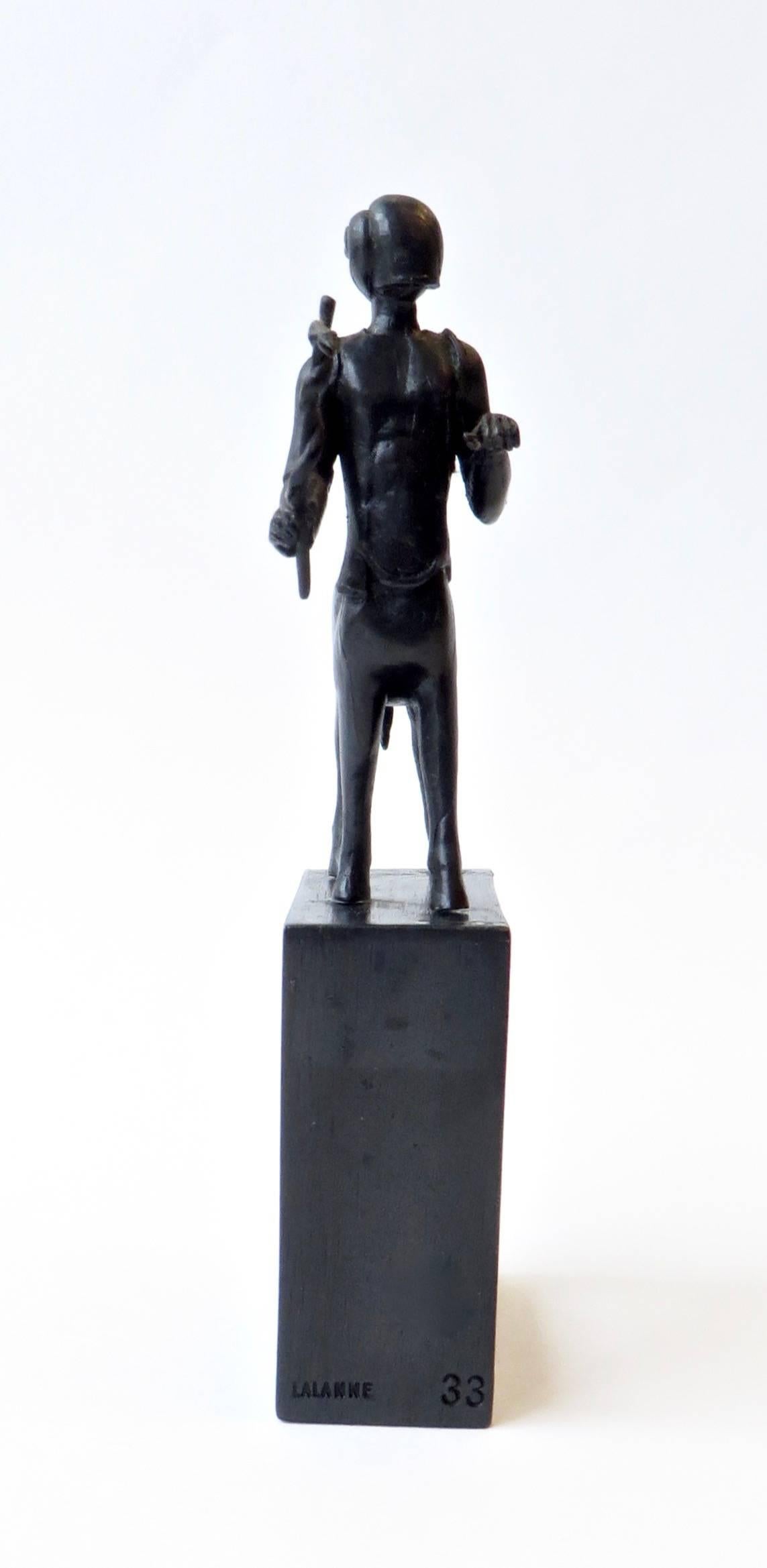 A Francois-Xavier Lalanne petit bronze centaure sculpture with a dark patina, circa 1985. 
This was a small gift of a limited edition made for clients of a French pharmaceutical company, thus the symbol he is carrying. 
The base is 2.5