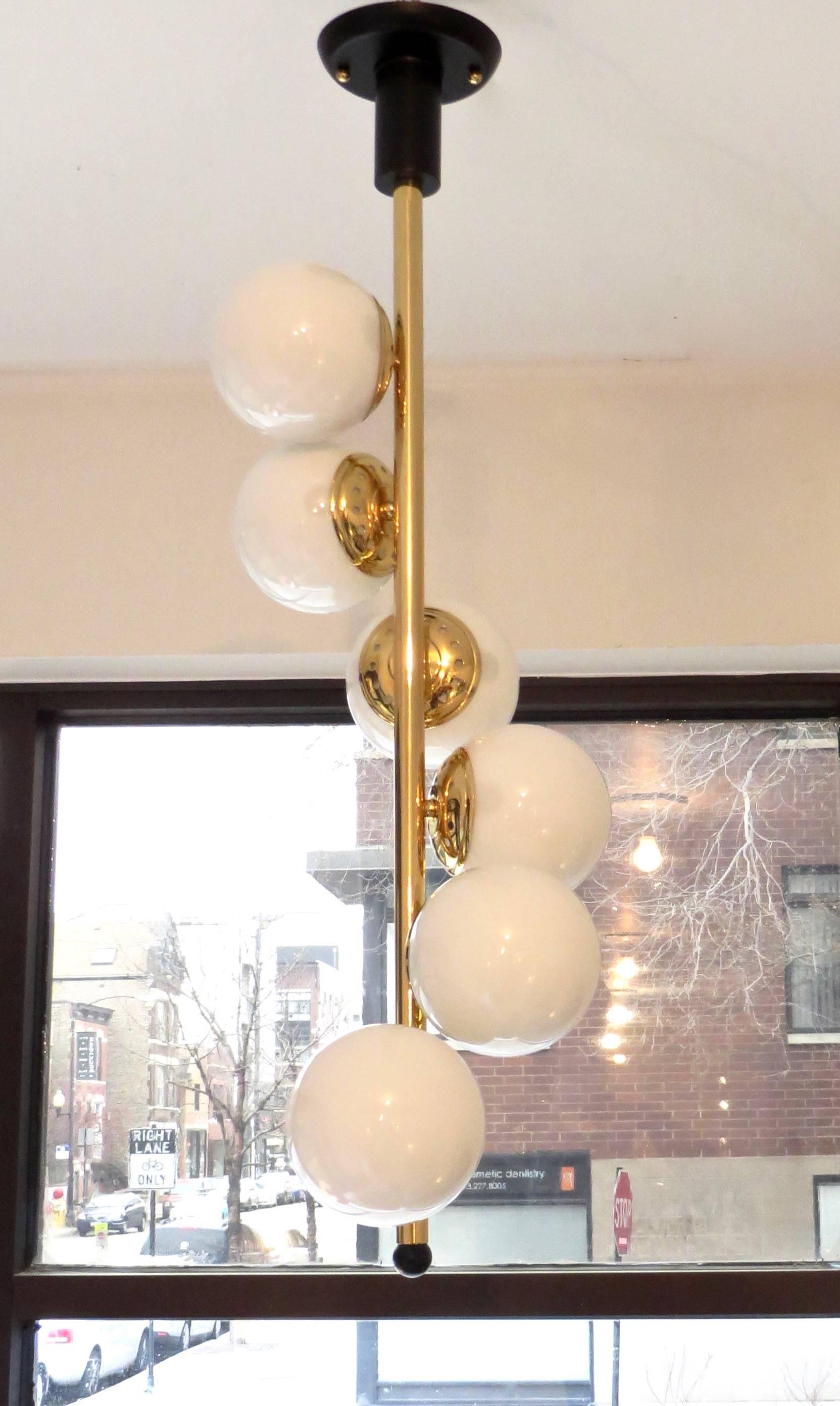 Mid-20th Century Italian Six-Light Brass and Glass Chandelier with Opaque White Globes, Stilnovo