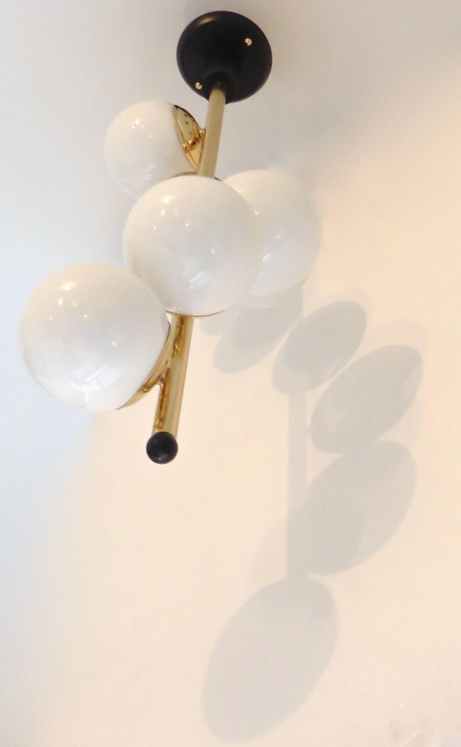 Italian Six-Light Brass and Glass Chandelier with Opaque White Globes, Stilnovo In Good Condition In Chicago, IL