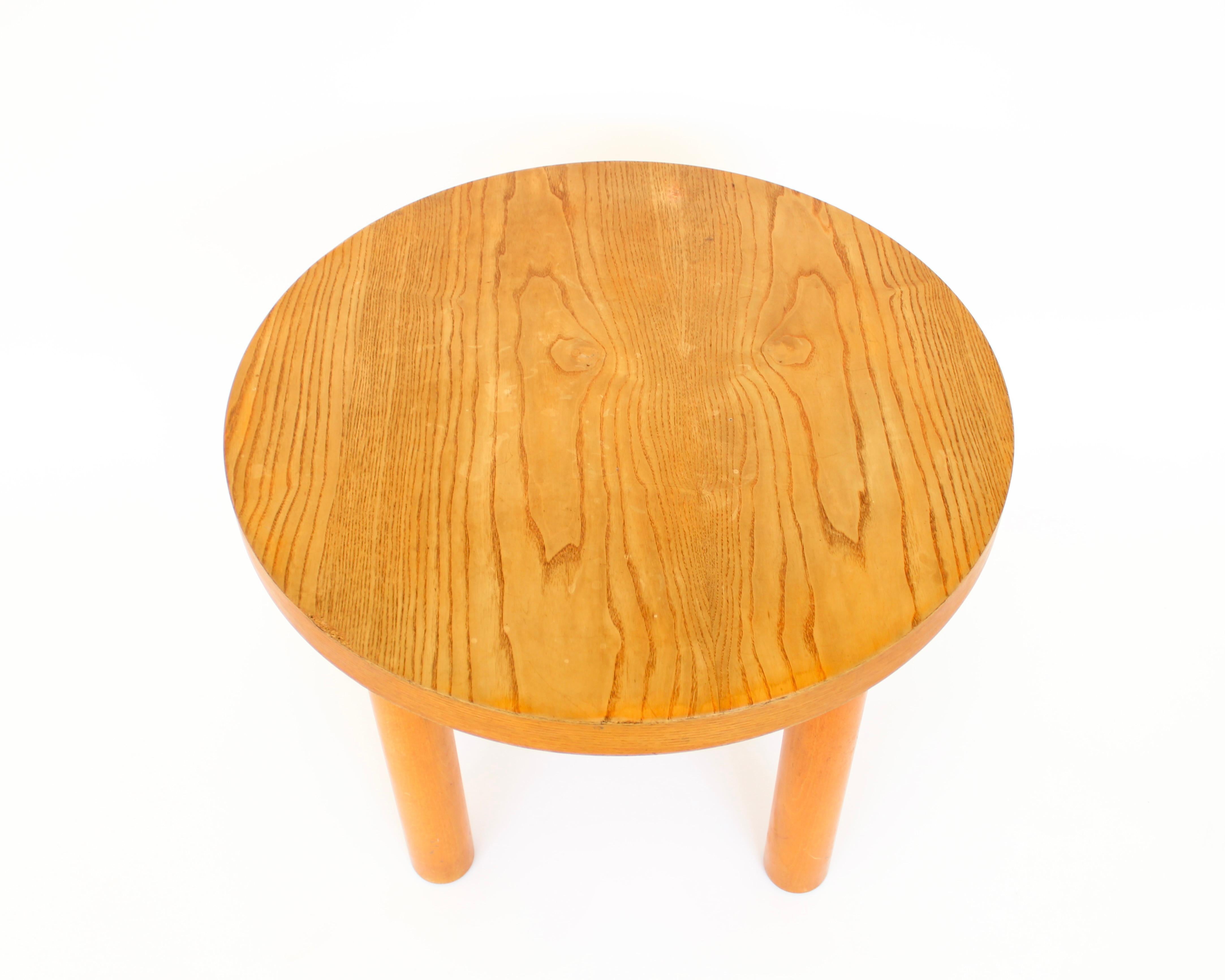 Charlotte Perriand round small coffee table or side table in pine wood. 
Most likely a furnishing in Les Arcs Meribel. 
This table shows off the beauty of the pine wood in its simplicity and its minimalist aesthetic coming from Perriands influences