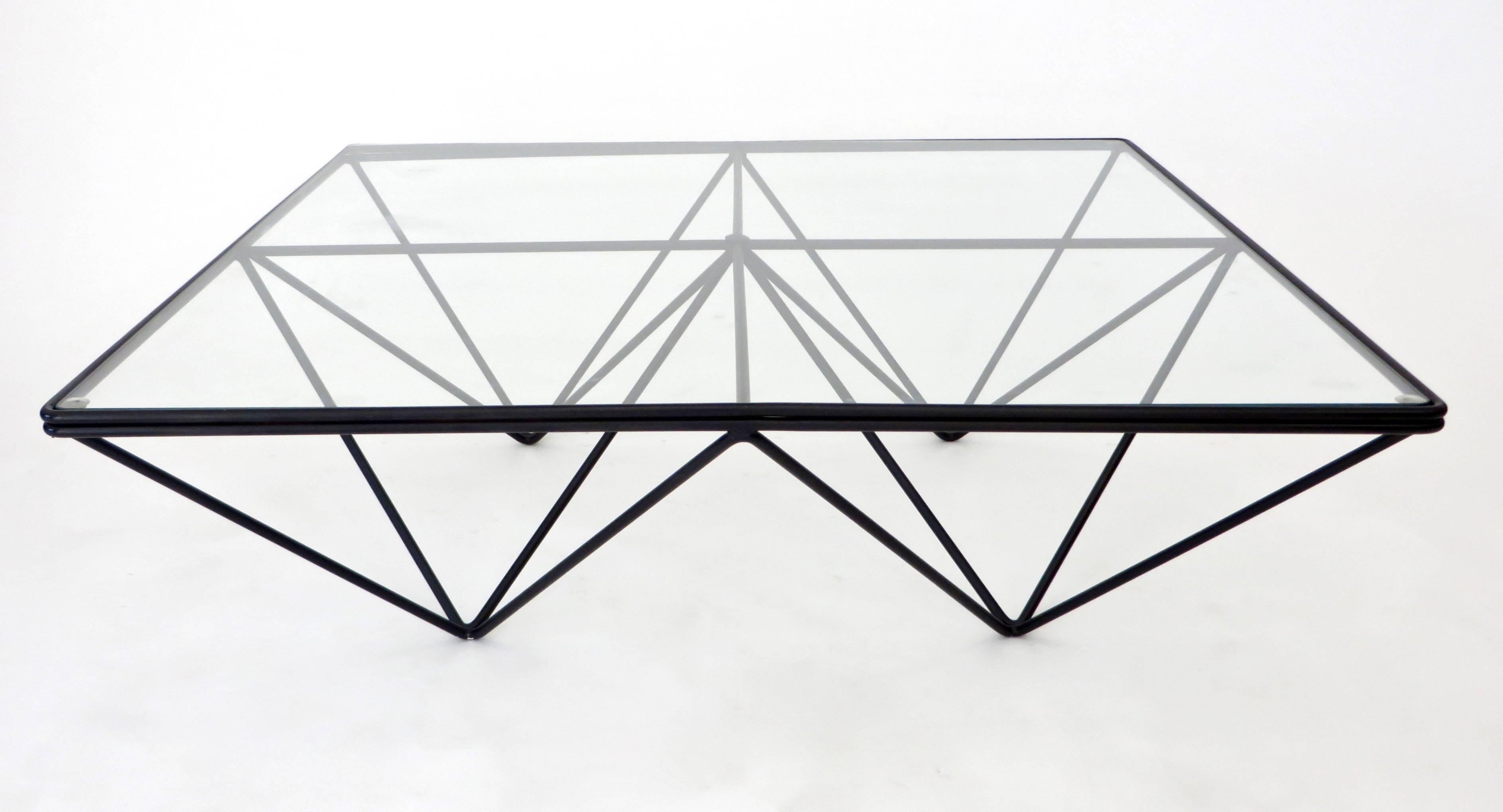 The Alanda low coffee table by Paolo Piva was edition by B&B, Italia, circa 1980. Welded enameled double steel rods with a glass top. 
Very graphic table with large glass plateau. Several sizes were designed and produced, no longer in