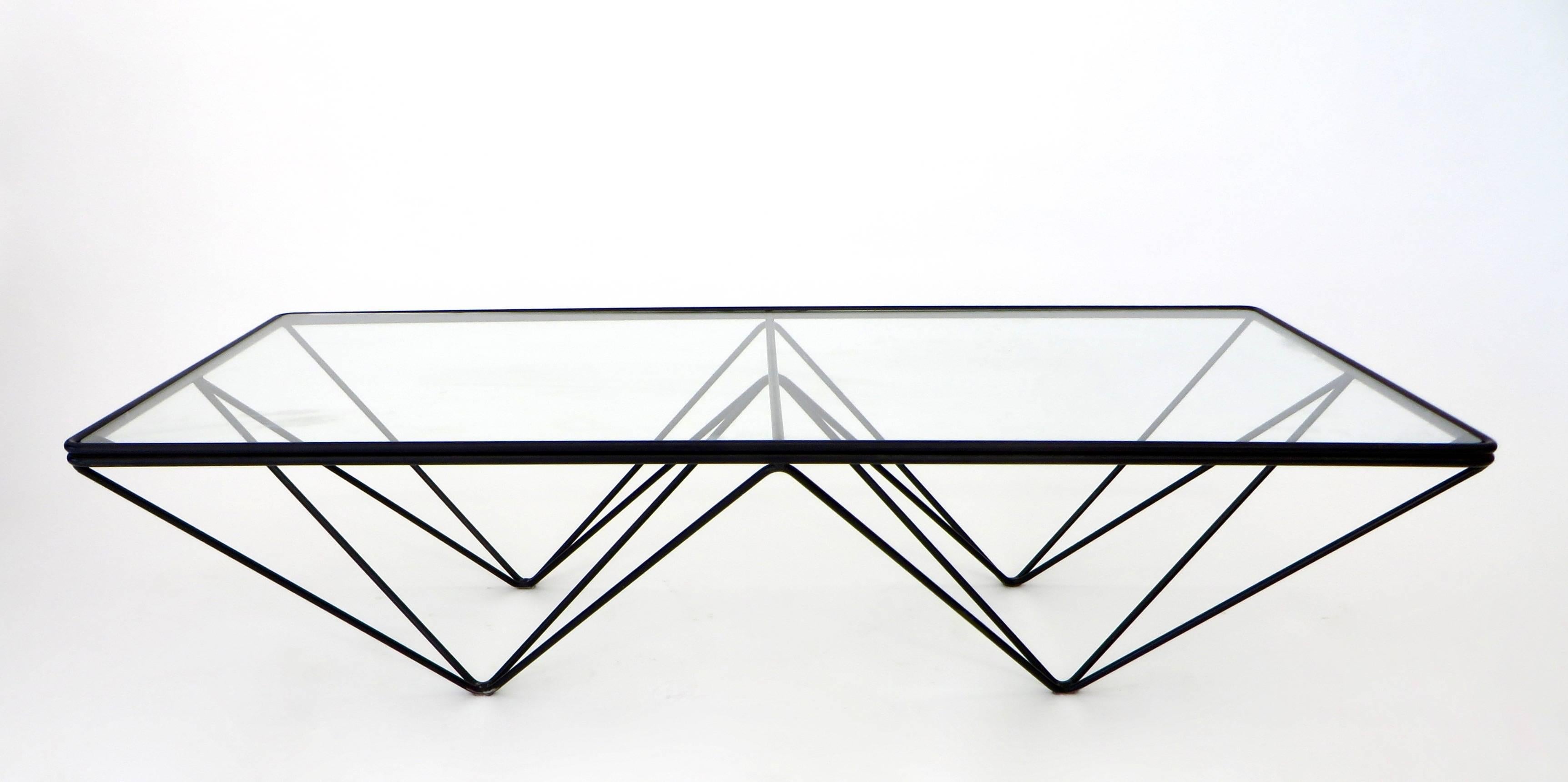 The Alanda low coffee table by Paolo Piva was edition by B&B Italia, circa 1980. Welded enameled double steel rods with a glass top. 
Very graphic table with large glass plateau. Several sizes were designed and produced, no longer in