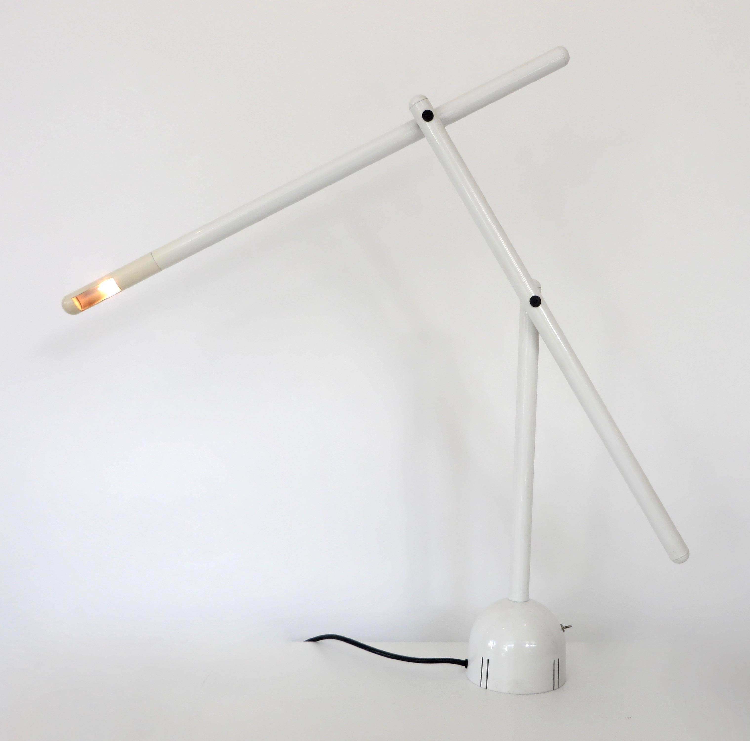 A Mira table lamp designed by Mario Arnaboldi for the Italian firm Programmaluce. Production of this lamp was very limited. This example in white enameled metal. Its arms can be adjusted and moved into a variety of positions emphasizing the angular
