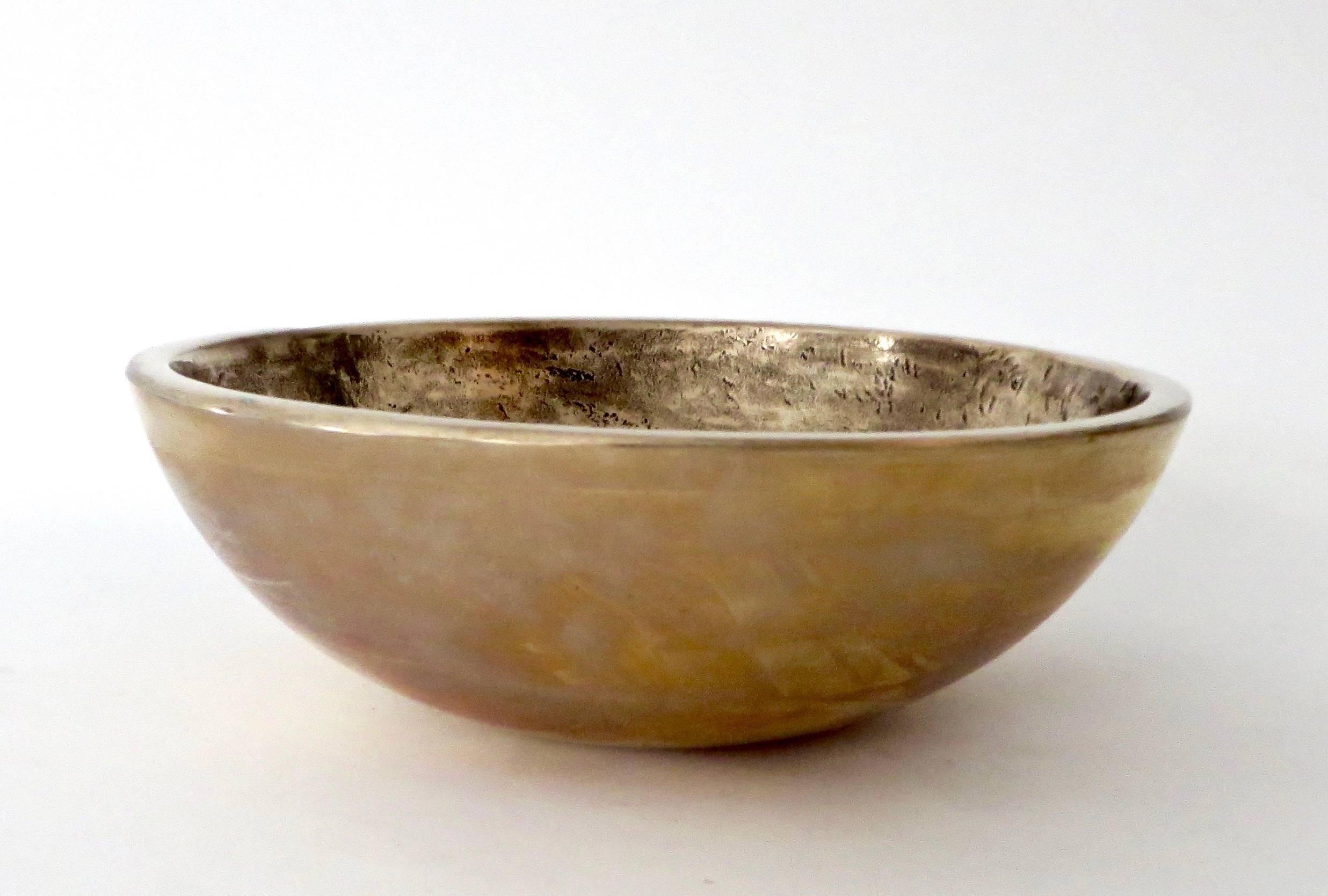 Bronze bowls by contemporary Chicago and Los Angeles based artist Elliot Bergman.
Inspired by the sound of the vessels when lightly rung, Bergman has incorporated them into his band Wilde Belle.
Sound vessels, sound sculptures, bronze.
Each bowl