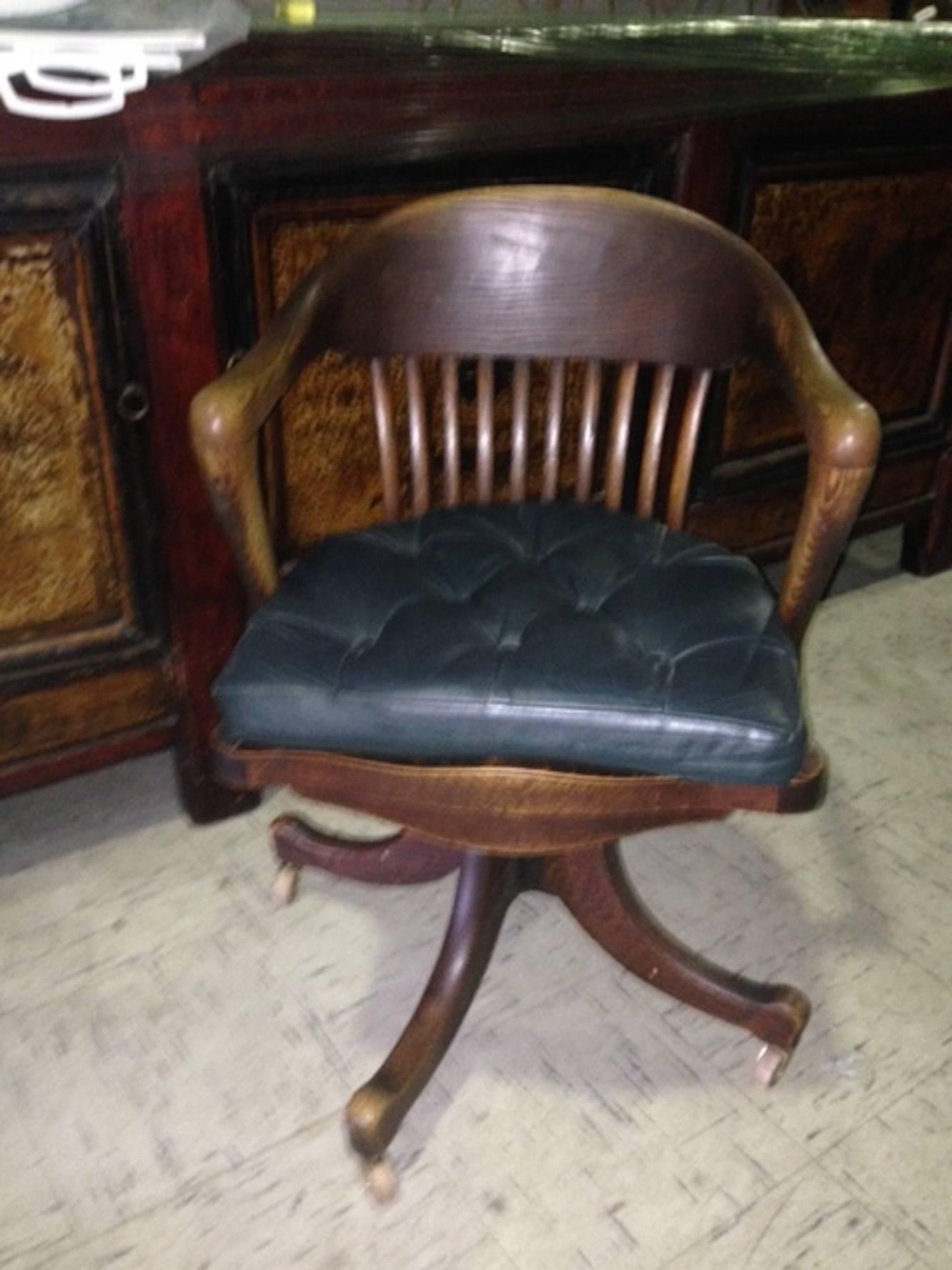19th century American oak desk chair from railroad station, swivel, tilt. Great old color and patina.
