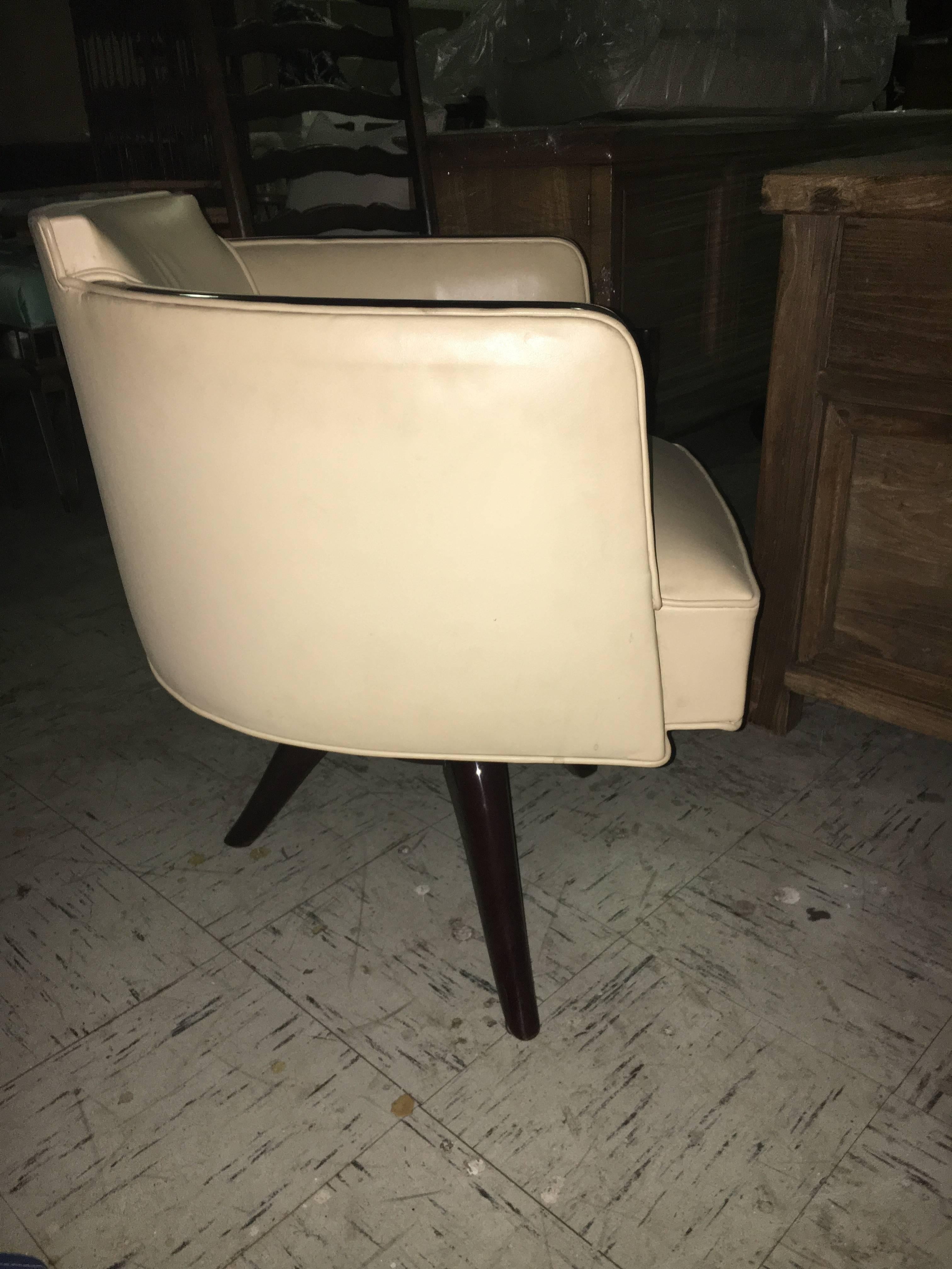 Very chic Art Deco style armchair or desk chair, wood frame upholstered in leather.
