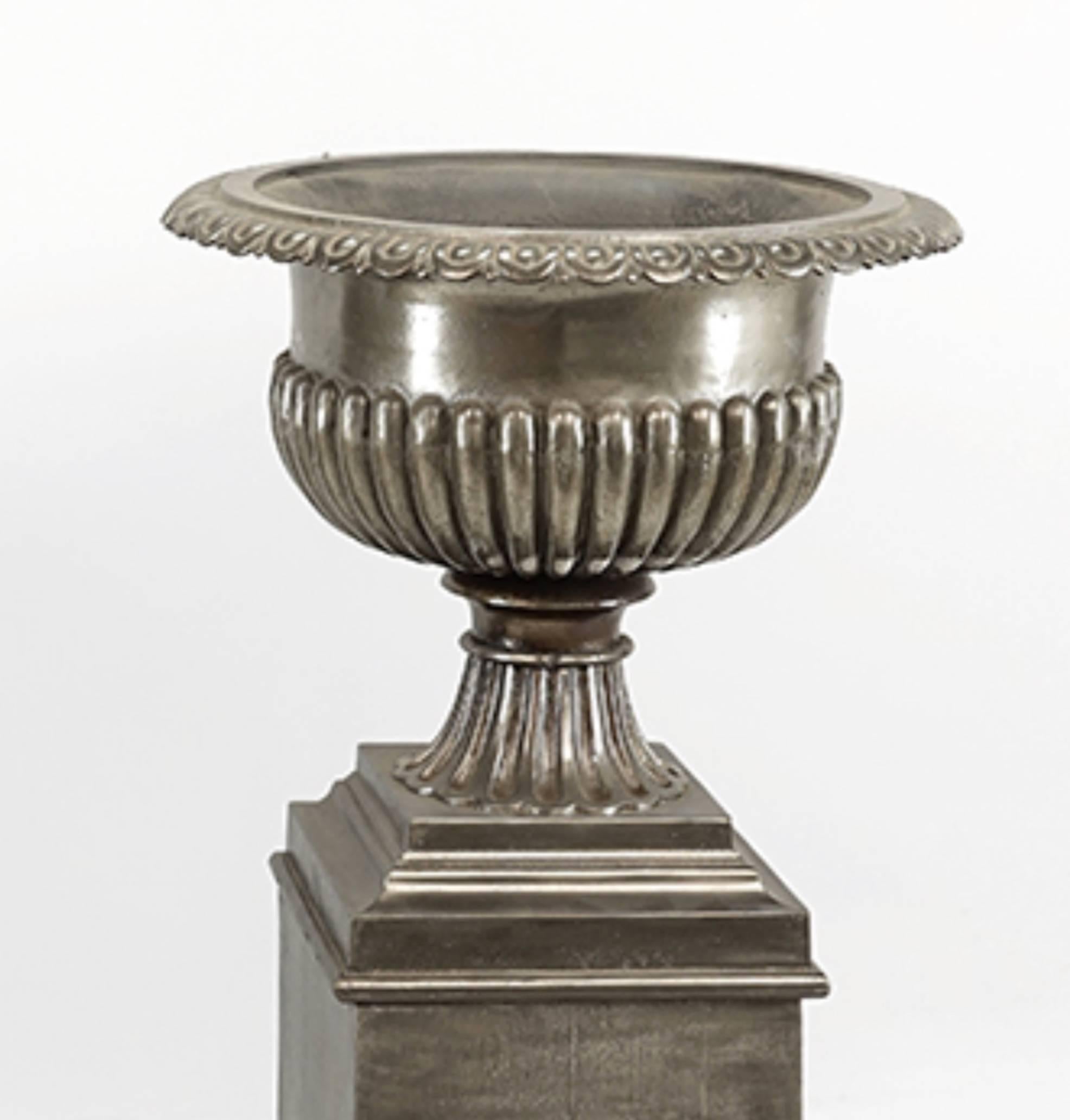 One pair very stately 19th century English urns on stands, brushed steel finish.  Great dramatic statement for entry, indoor or out door use.  