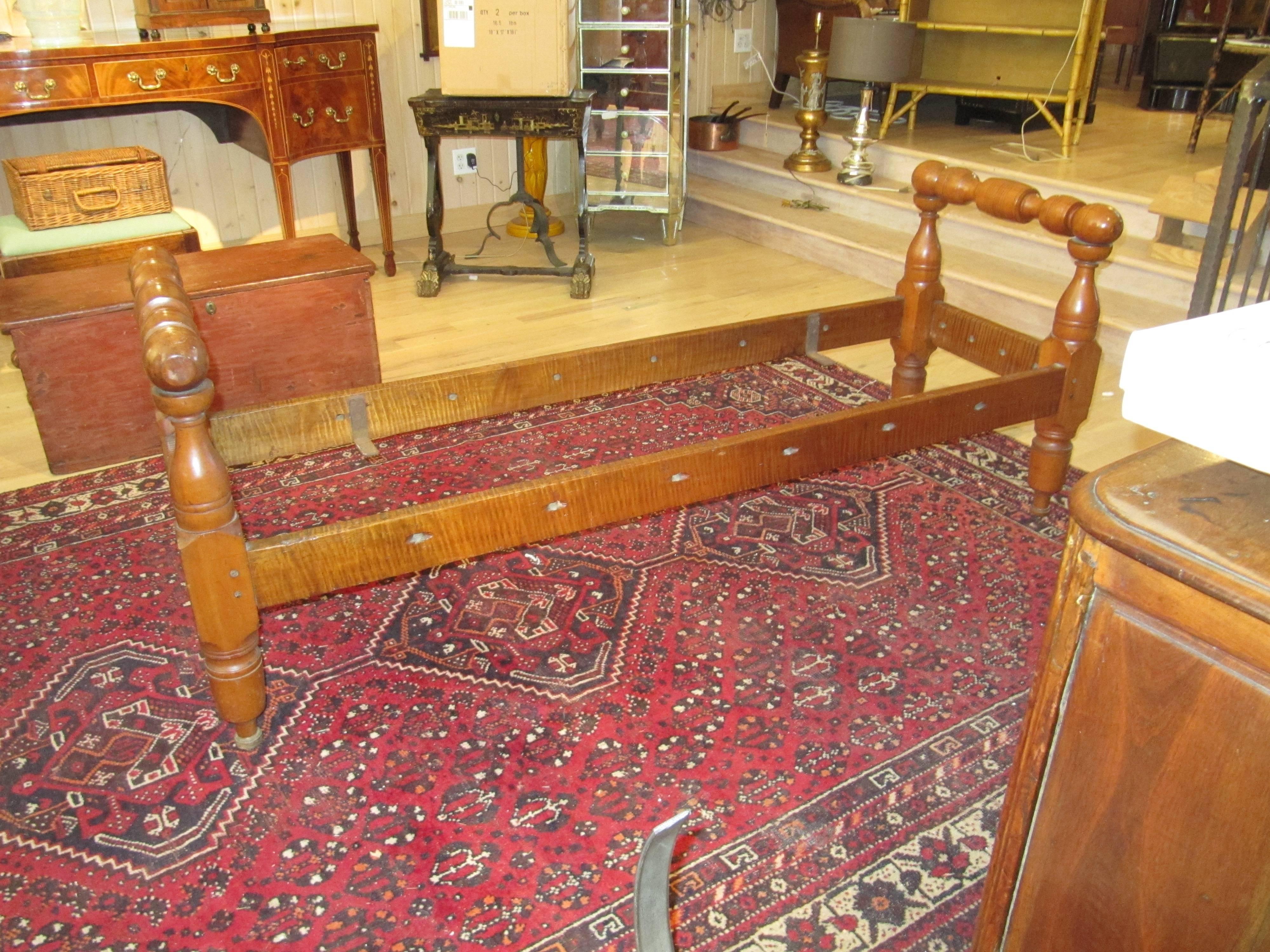 An American Provincial maple daybed 19th century
having a ring turned head and foot board joined by straight side rails.
Width 73 inches. Great piece as a bench at the foot of the bed or hallway.