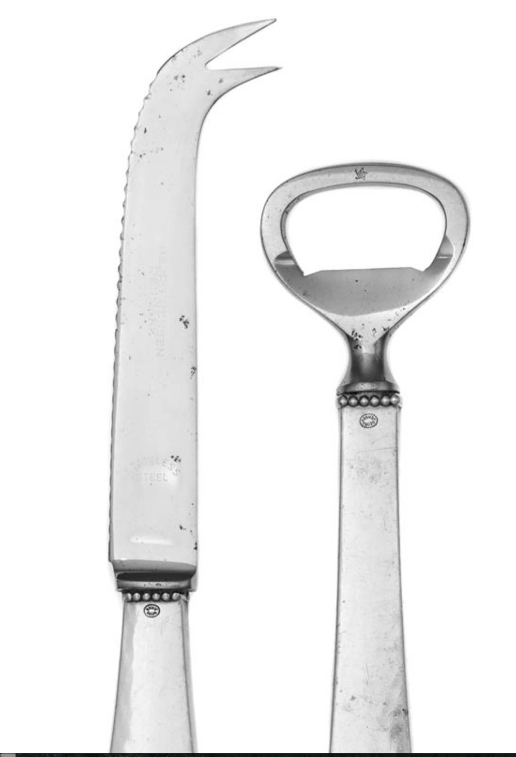 A Danish silver bar set of
Georg Jensen Silversmithy, Copenhagen.
In the beaded pattern, comprising a bottle opener and bar knife.
Marked on handles.
Length of bar knife 7 1/4 inches.