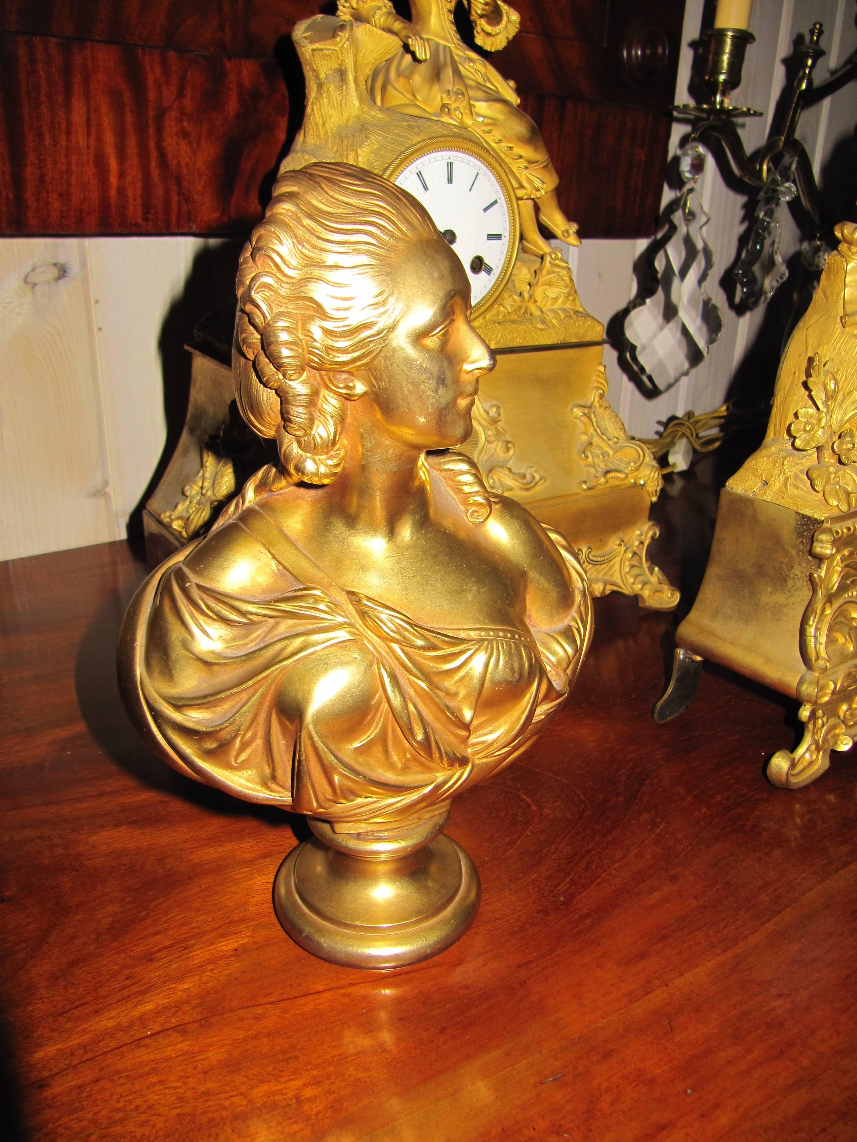 Charming gilt bronze bust of a woman, spectacular gilt finish.