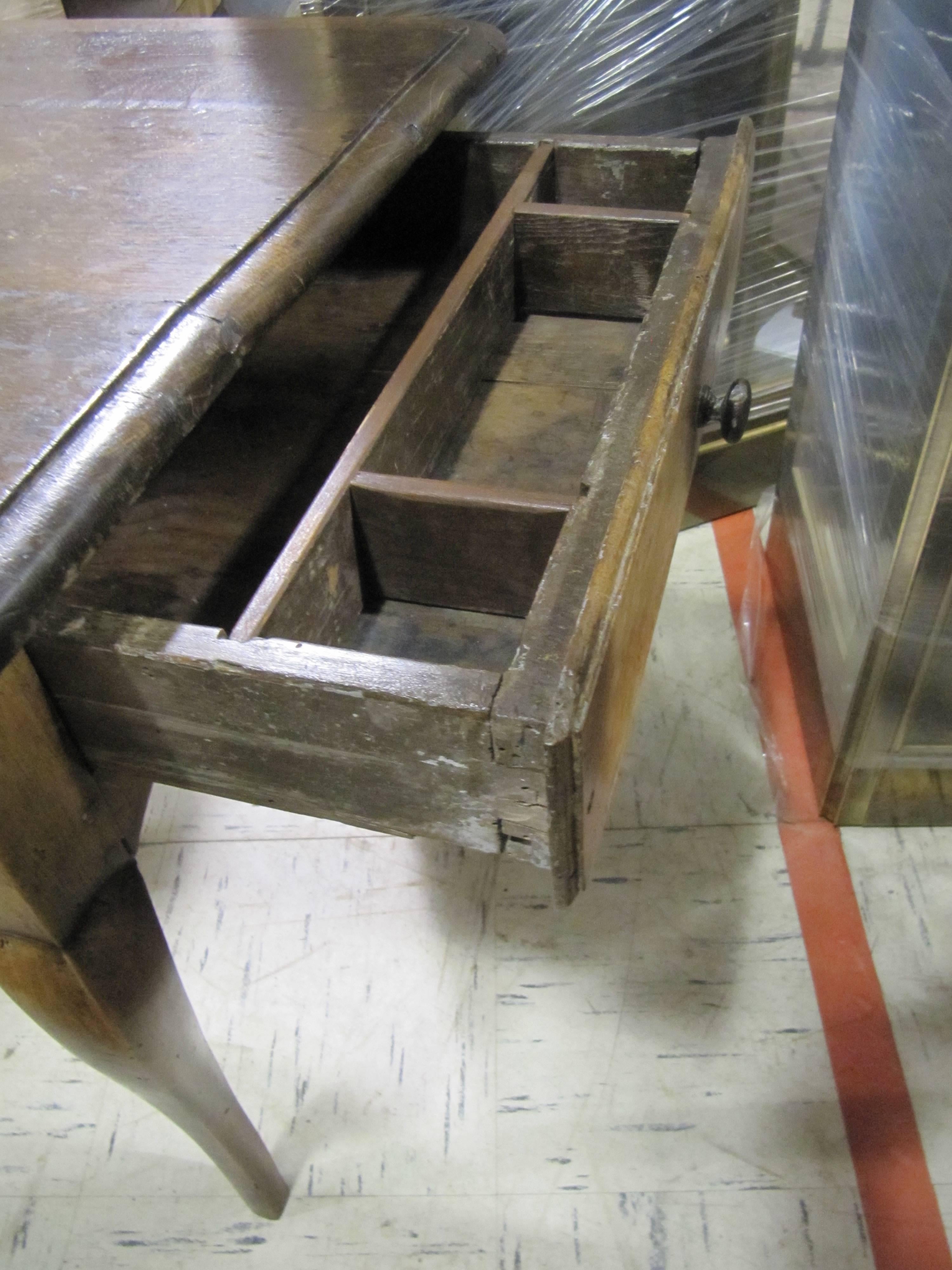 Charming 18th century Provincial side table, great old color and patination. Rectangular top over single drawer raised on cabriole legs.