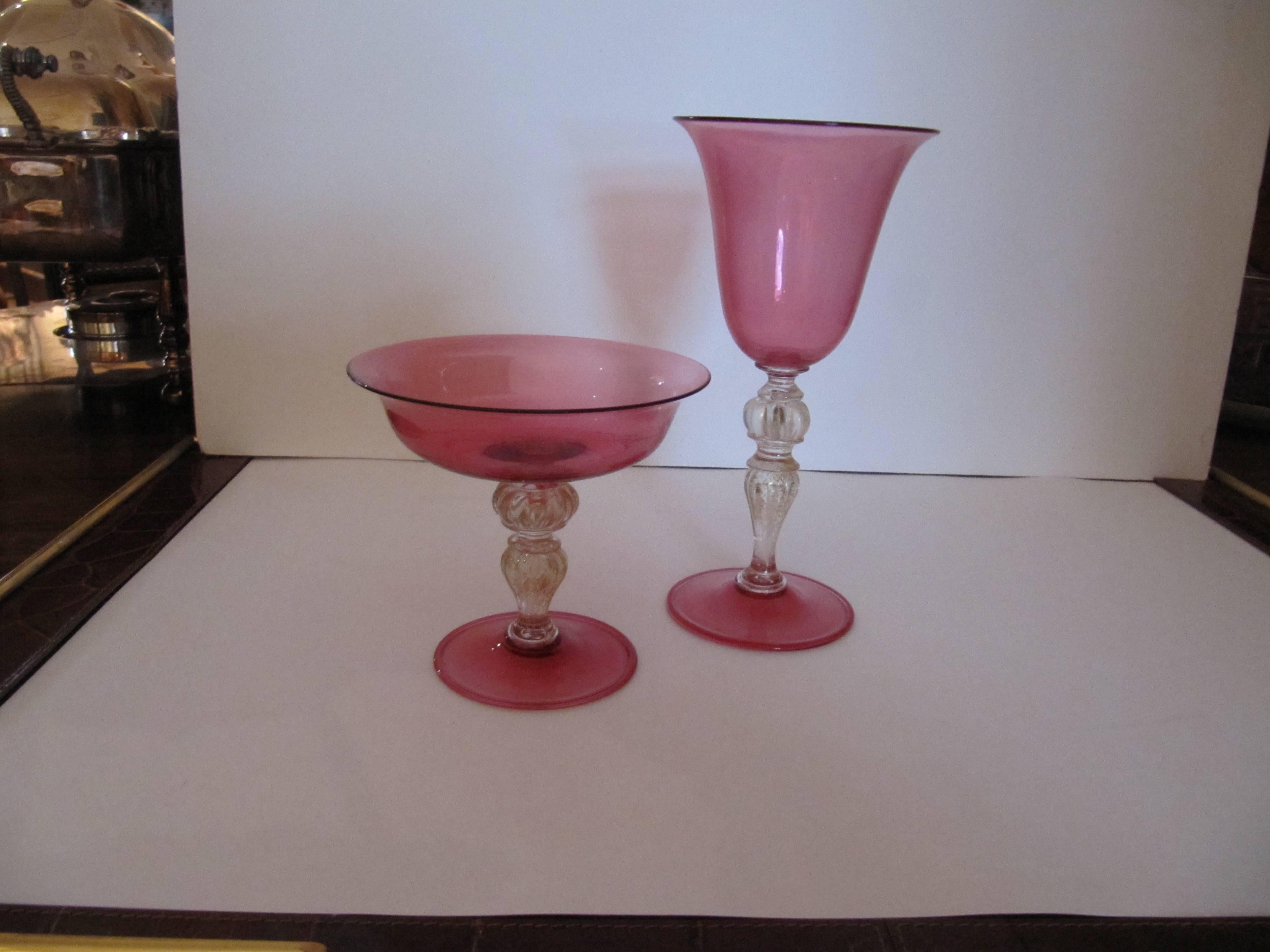Extensive collection of cranberry handblown Venetian glass stemware, plates and tumblers. Consisting of 11 large wines or water goblets 4