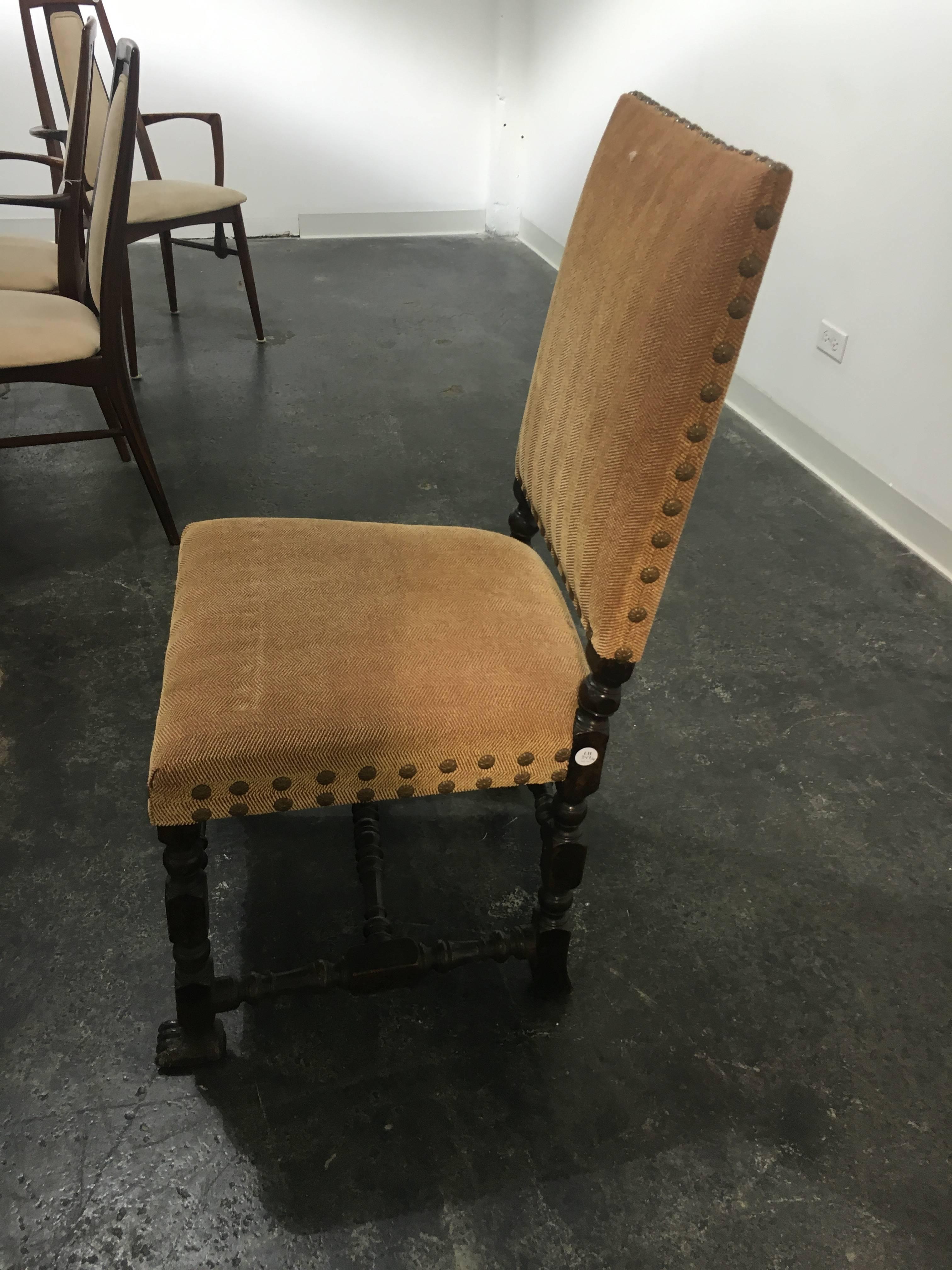 A set of Four Jacobean style side chairs height 39 1/2 inches each having a rectangular padded back and seat, raised on turned legs joined by stretchers. Great chairs for a games table. Please confirm measurements.