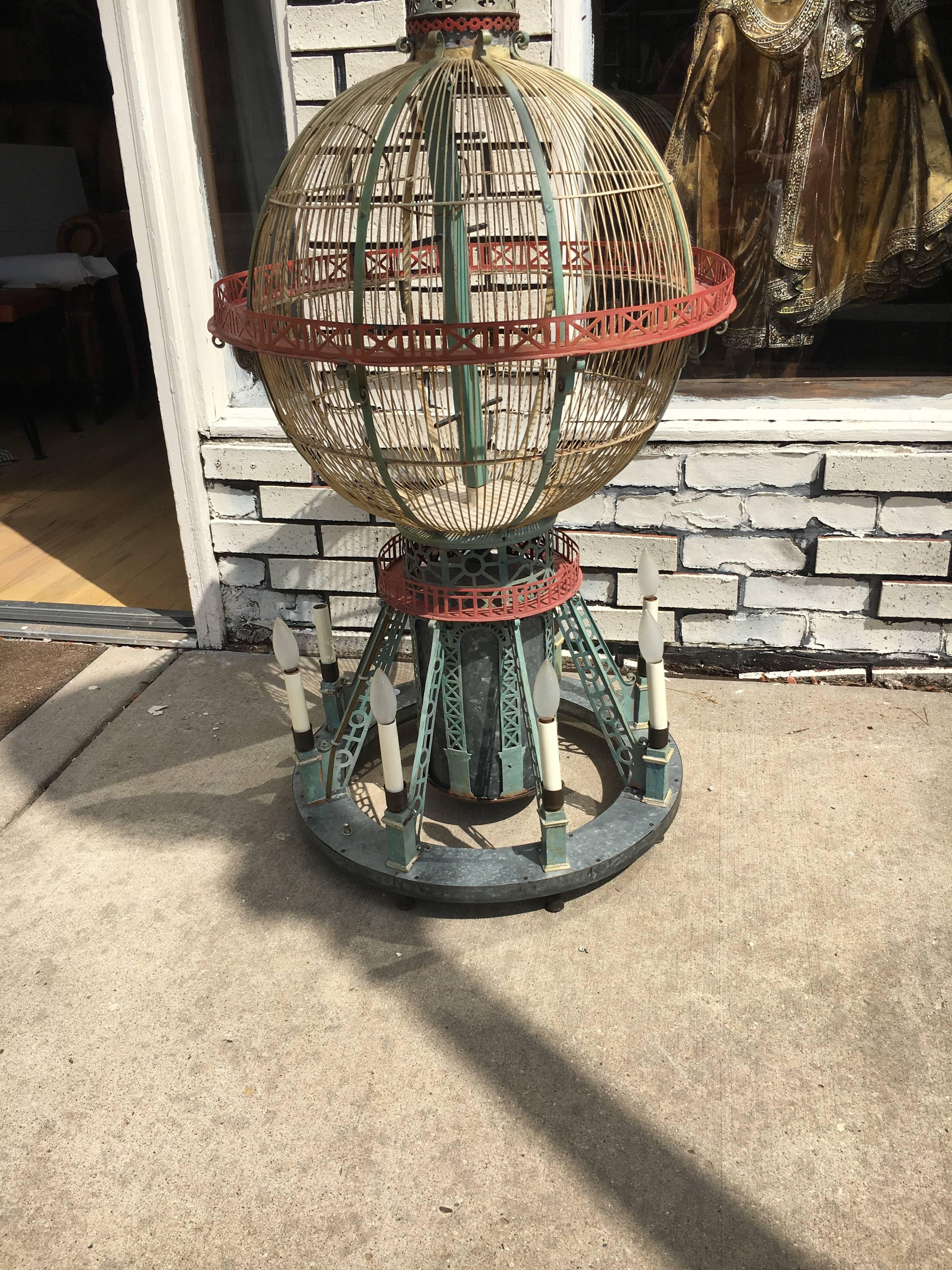 Whimsical and Fun six arm chandelier in the form of a hot air balloon or birdcage. Can be hung as a chandelier or lite accent table lamp.