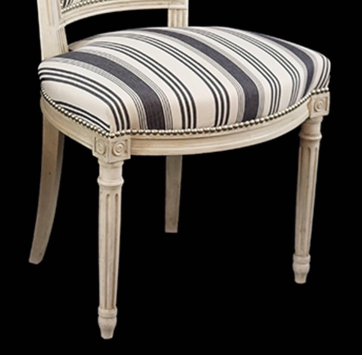 

Handsome set of six Louis XVI style side chairs covered in blue and white stripe cotton fabric with nickel nailhead trim.  Great Scale.  Feel free to call or email with further questions.
  