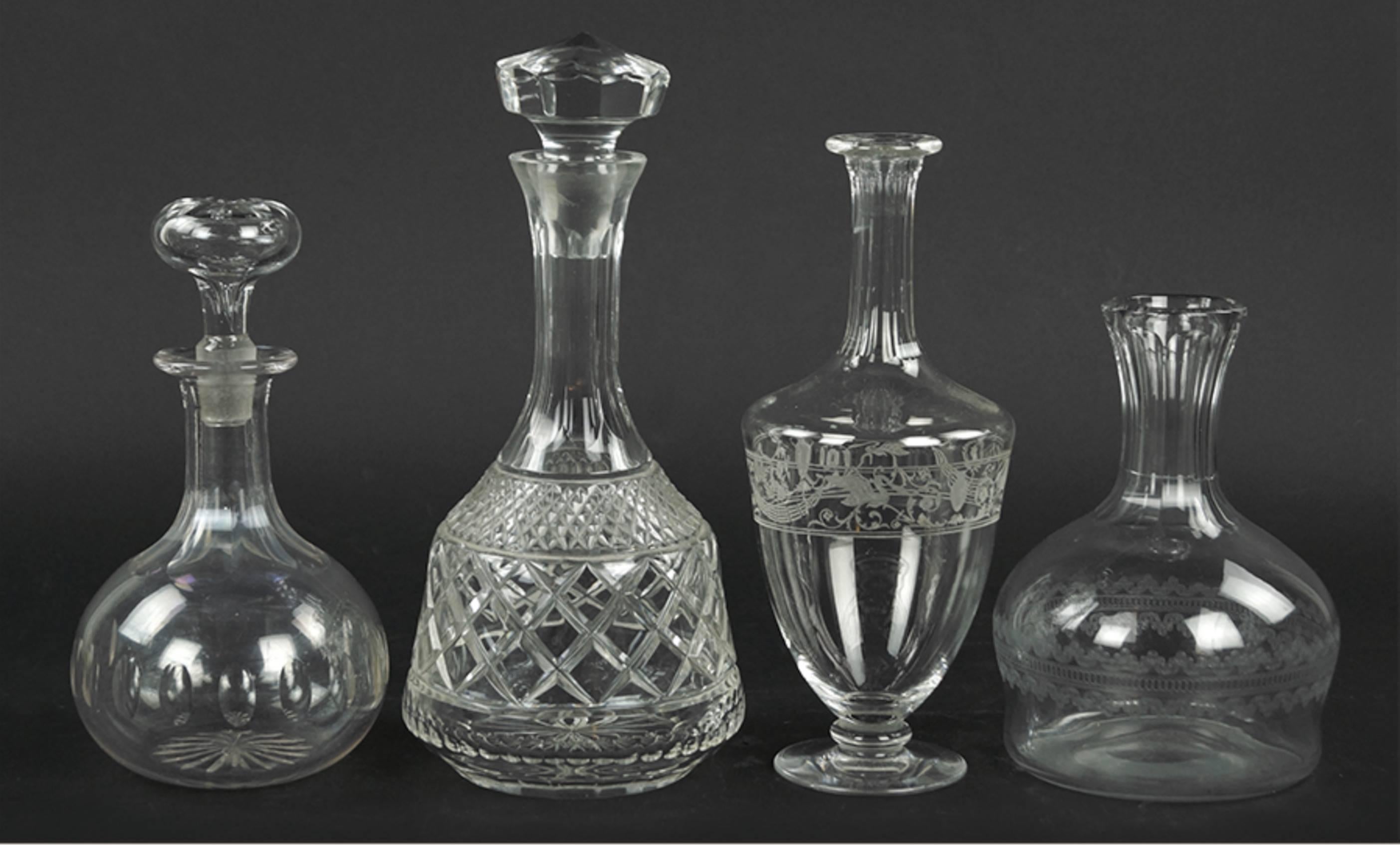A Collection Of Ten Cut Glass Decanters Of Various Forms And Makers. 
Comprising a near set of three and two others.  We have a large selection of vintage barware including Steuben, Baccarat, Waterford, Imperial etc....  Feel free to call or email