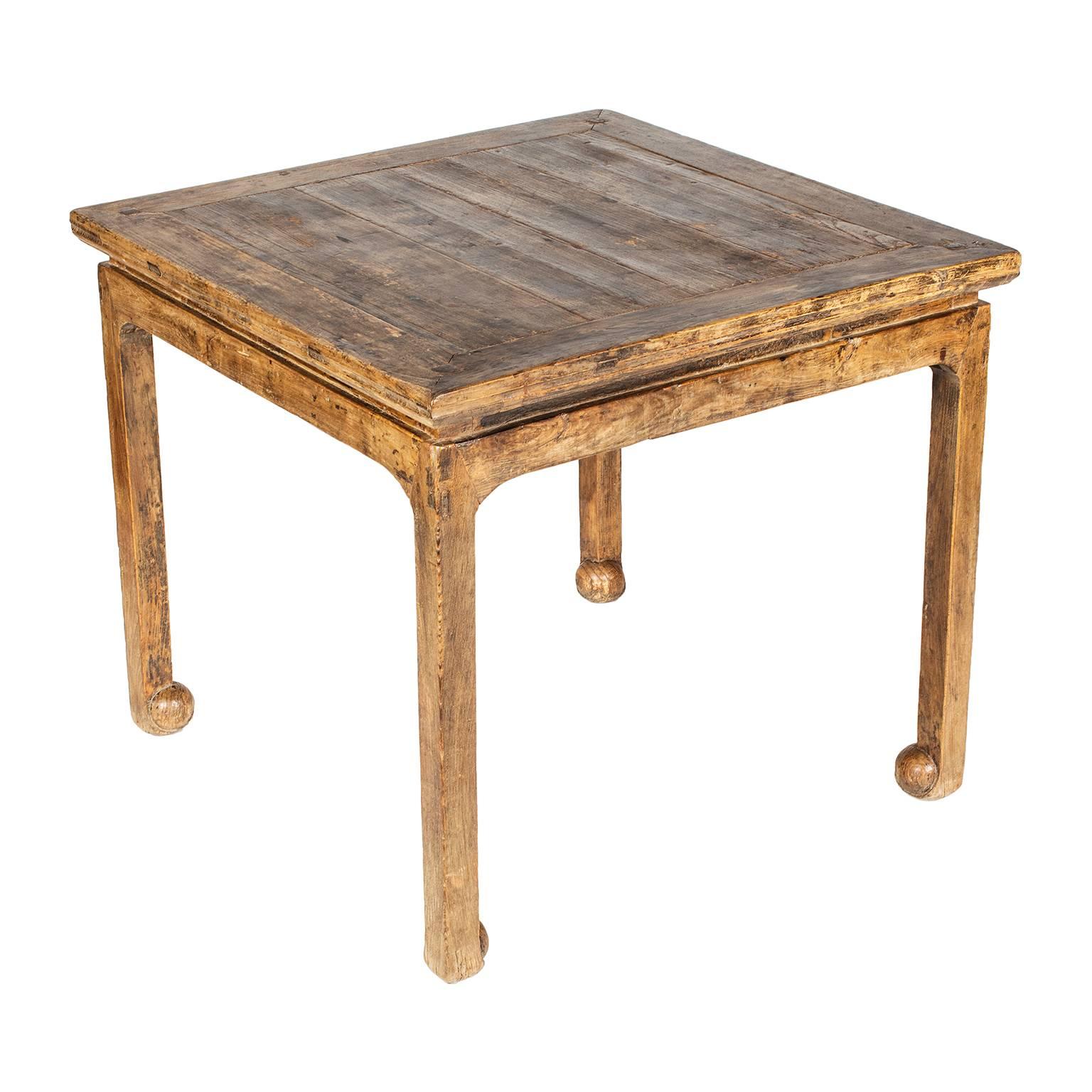 This exquisitely carved table has subtle features that beautifully exemplify Chinese furniture design from the late Ming period: The simplicity of line, overall form and complex joinery. Unusual about this table is the way the feet scroll inward and
