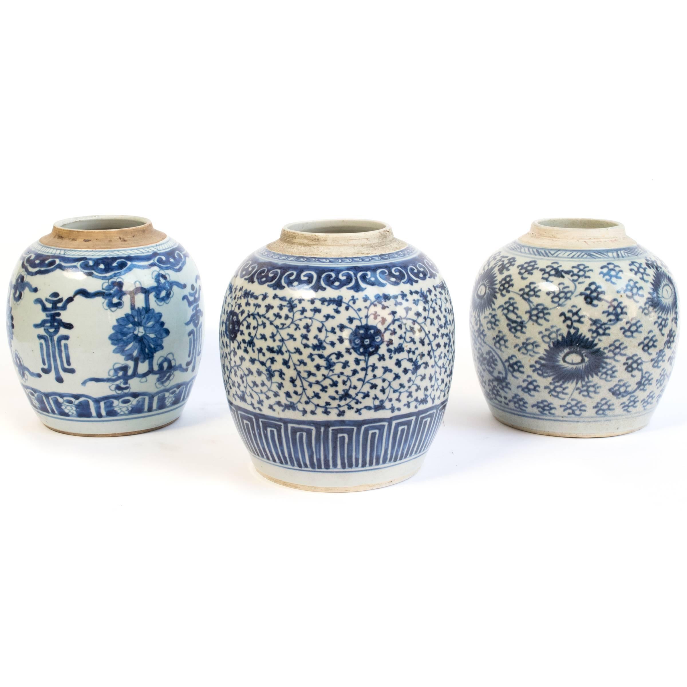 These elegant porcelain jars, in forms often called ginger jars, were originally intended to hold spices. Each has a traditional blue and white floral design, elegantly painted by a 19th century skilled artisan. The jars became popular decorative