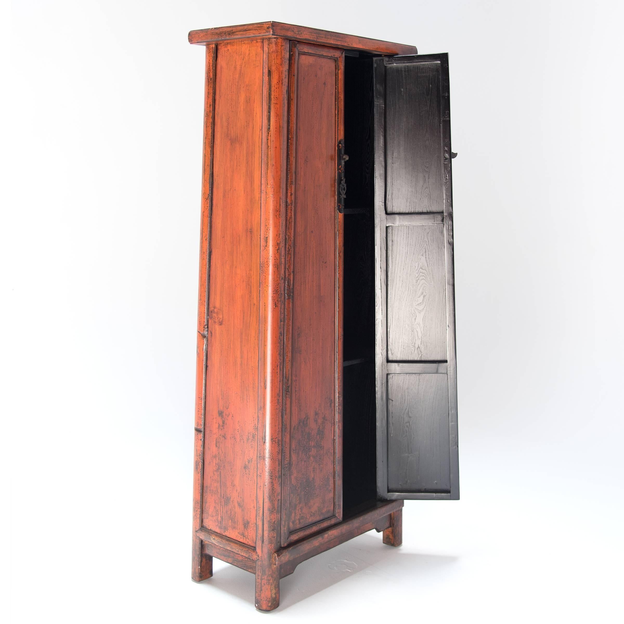 A master craftsman from China’s Hebei Province made this narrow cabinet over a hundred years ago. It has beautiful hardware and simple, clean lines that sweep upward at a slightly tapered angle and give the overall cabinet a lighter form. It is