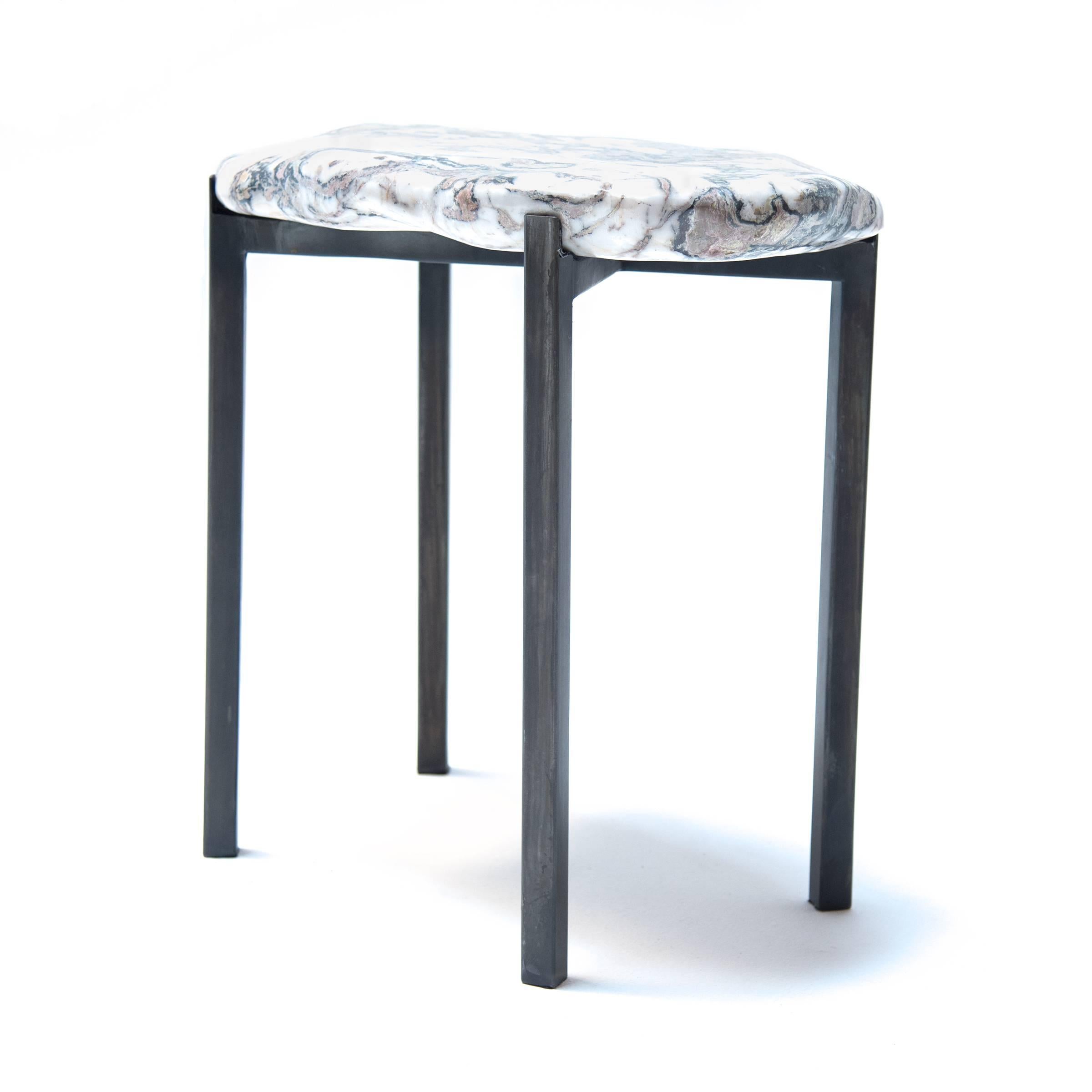 For centuries, Chinese artists have appreciated meditation stones (like the one used to make this table top) as inspiration for painting, poetry and calligraphy. The modern, custom steel base creates a striking contrast with the natural beauty of