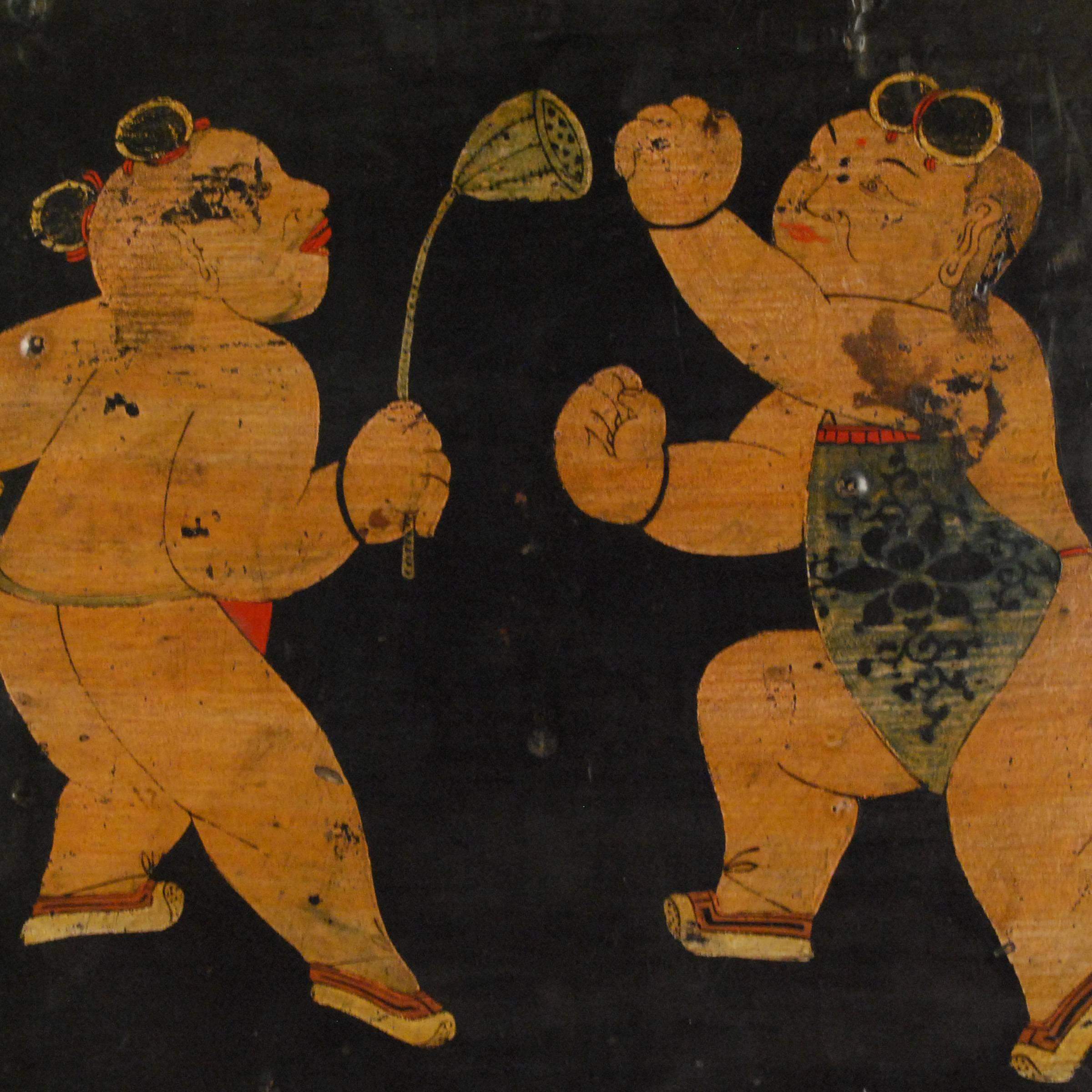 This folk hand-painted panel, laden with meaning, was once an interior panel of a large cabinet. The whimsical boys are dressed in traditional aprons. One is holding a lotus pod, which represents a parent's wish for 