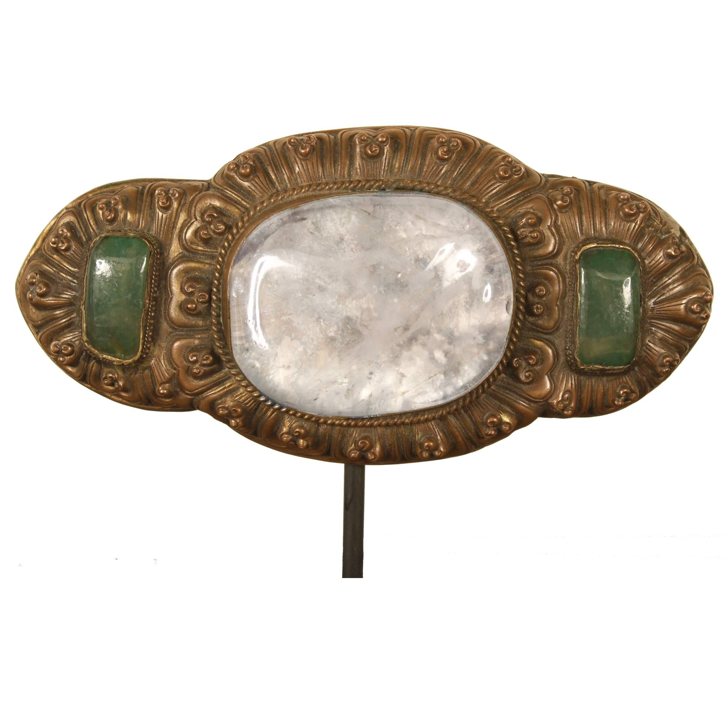 This 19th century Chinese belt buckle features an exceptional specimen of rock crystal flanked by two jade cabochons. The 19th century was an interesting period for fashion. Eastern and Western designers were influencing one another and this buckle