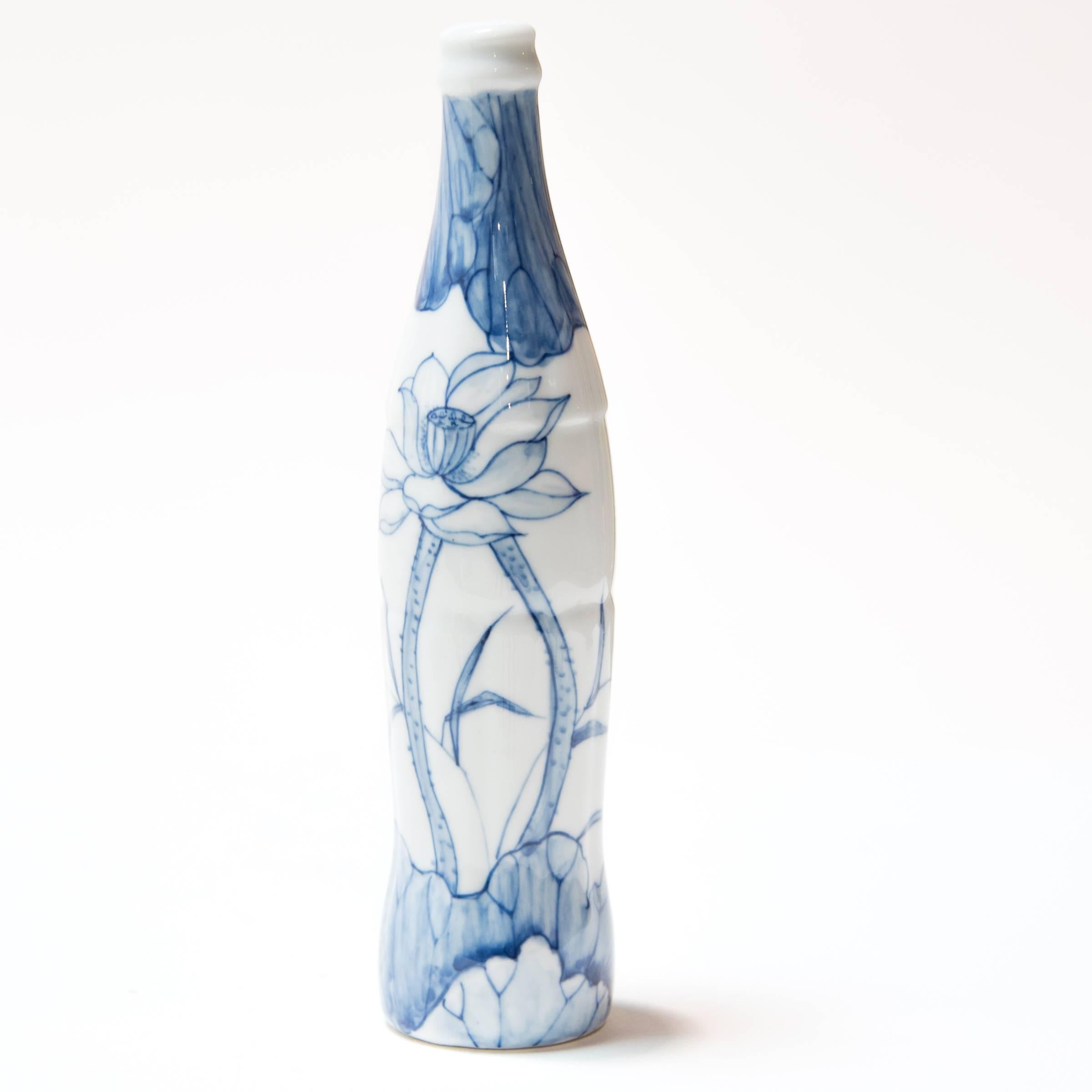 Contemporary artist Taikkun Li designed this delightful porcelain cola bottle. Painted with a scene reminiscent of the Ming Dynasty’s famous blue and white ceramics, this bottle deftly combines old and new, East and West. Taikkun Li's work blurs the