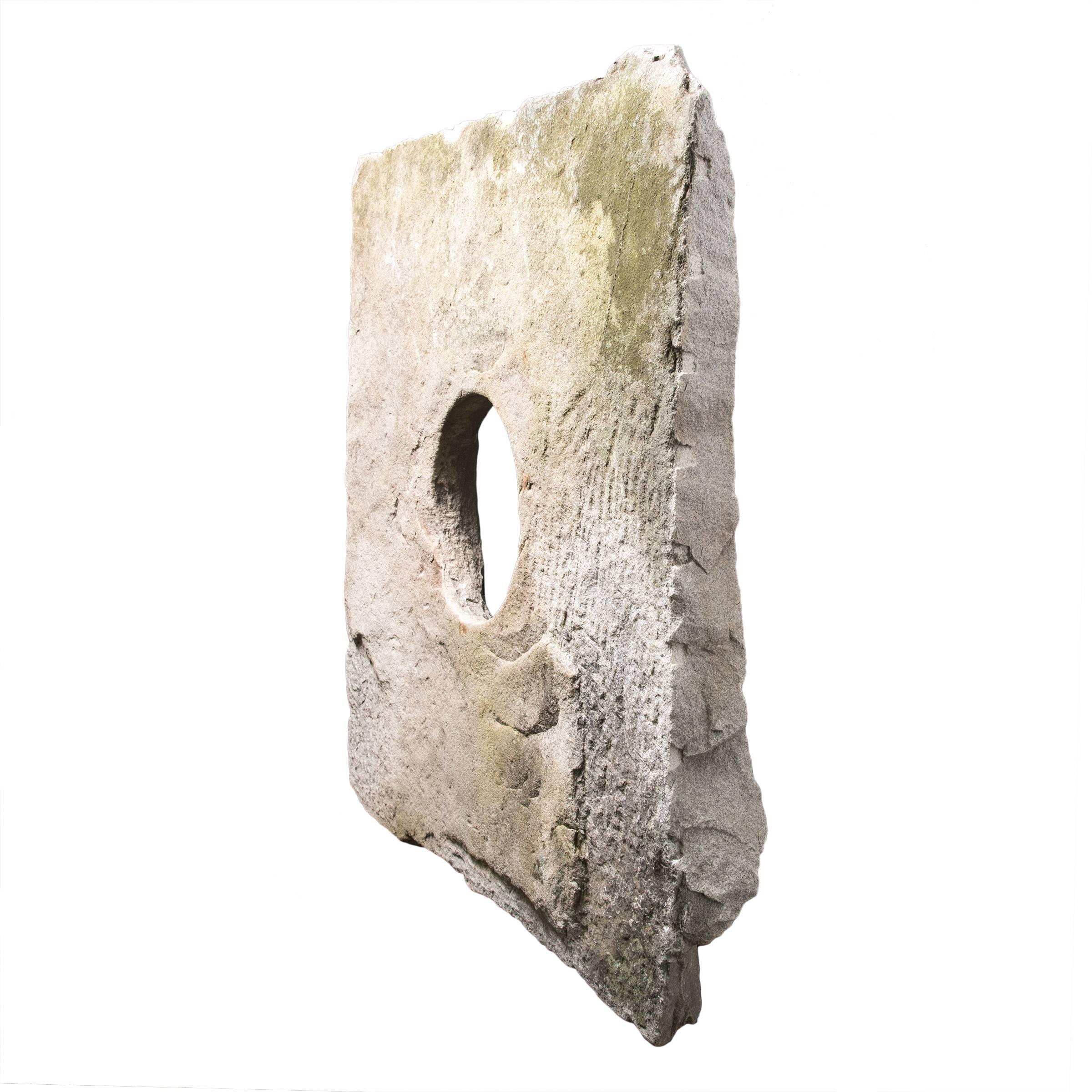 A traditional stone well head can be used to create an unusual and unique focal point in your garden. This 18th century limestone surround comes with a custom metal stand. It was recovered from a farm in Maine and is a lovely example of a typical