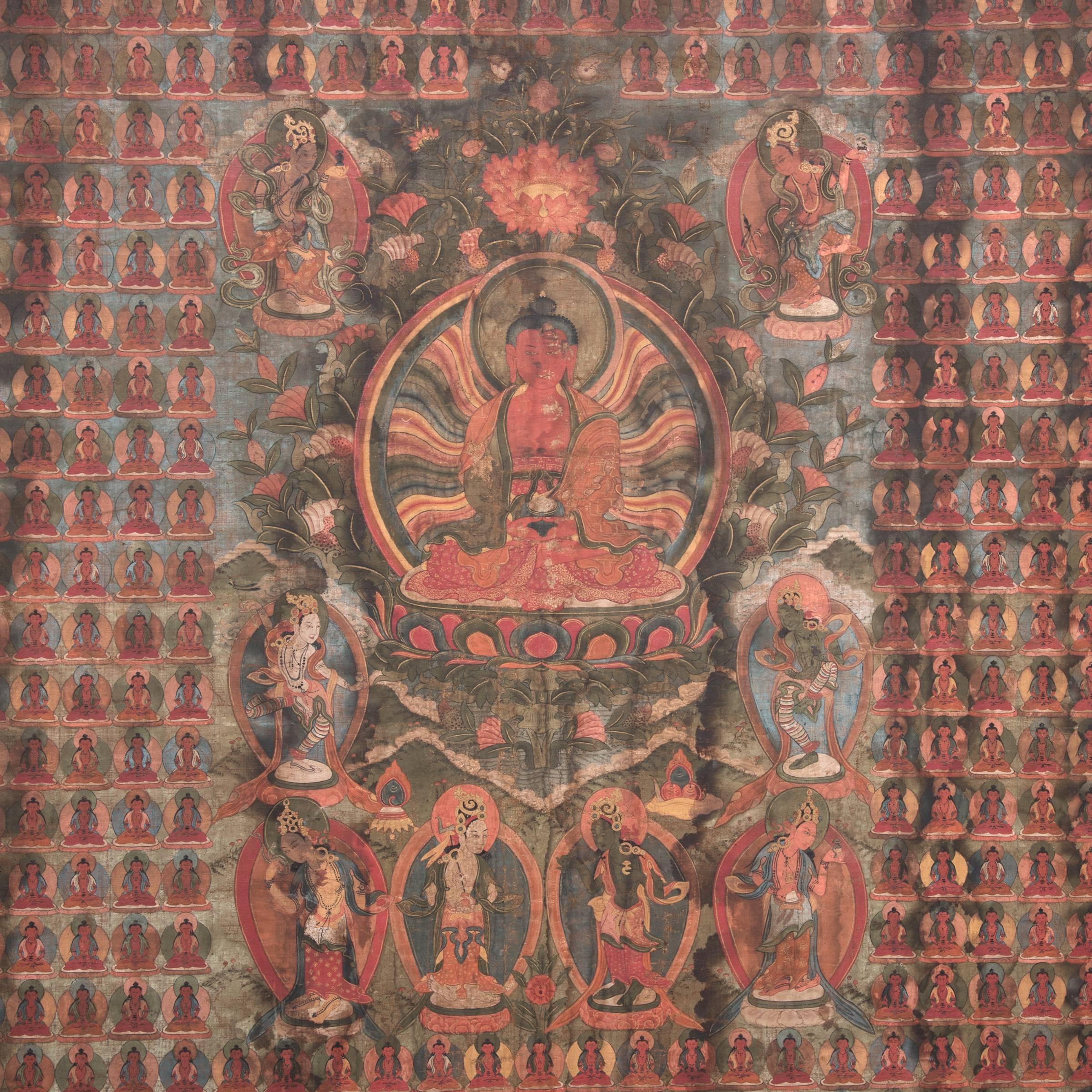 This Tibetan thangka, or sacred painting, is over 300 years old. The rich red, green, and blue hues are still incredibly vibrant. The central figure is a Buddha surrounded by goddesses and attendants, amidst a field of hundreds of seated figures.