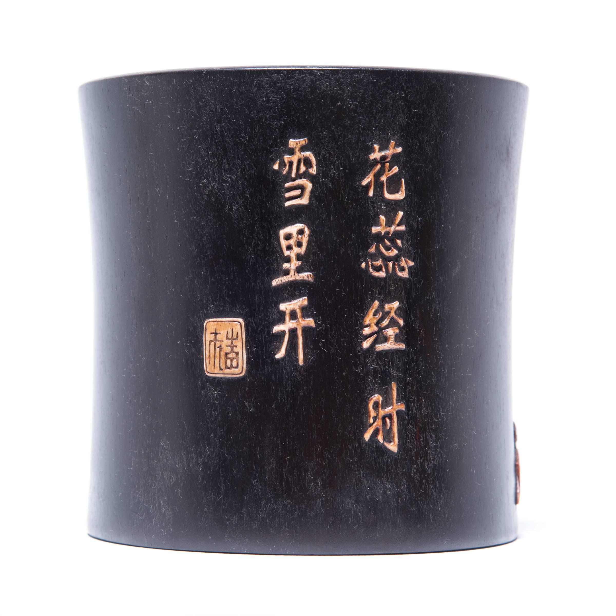 A brush pot or bitong, such as this one, was often found among a scholar’s brushes, inkpot, and inkstone. This beautiful example is carved from zitan, a highly prized rare and slow-growing hardwood. Mother-of-pearl and soapstone inlays embellish the