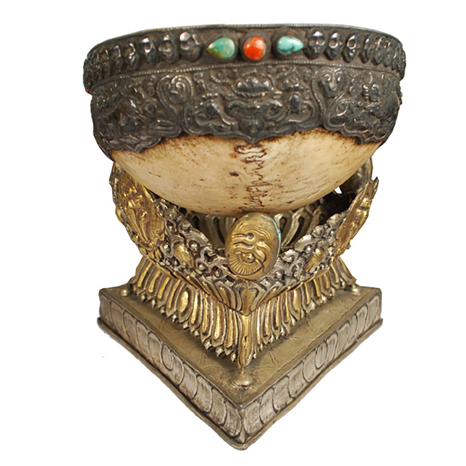 A Sanskrit term meaning “skull,” this 18th century kapala incorporates a human skull into the bowl of a ritual vessel. According to ancient Tibetan custom, skulls for this purpose were collected at burial sites, where remains were scattered to