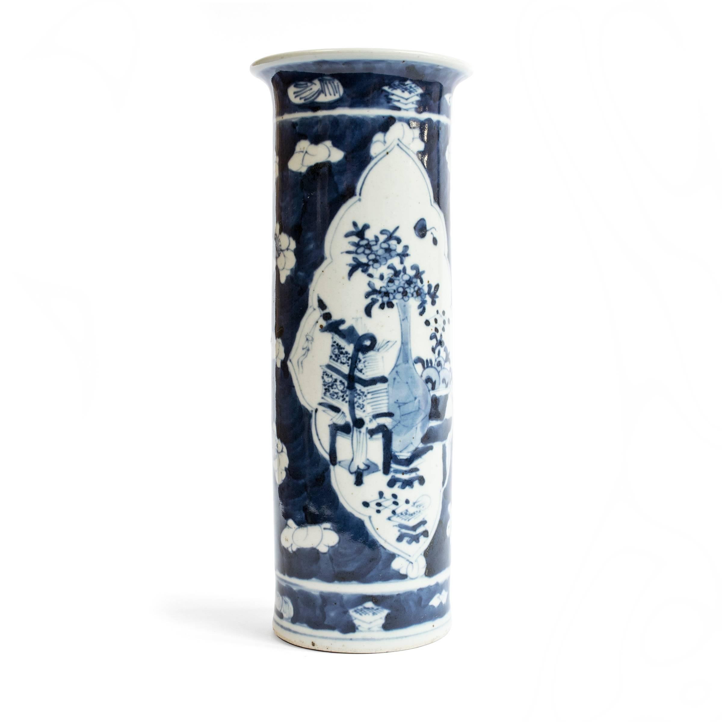 Chinese blue-and-white porcelain has inspired ceramists worldwide since cobalt was first introduced to China from the Middle East thousands of years ago. Made in the early 20th century this tall vase provides a seamless surface for decoration. Bold