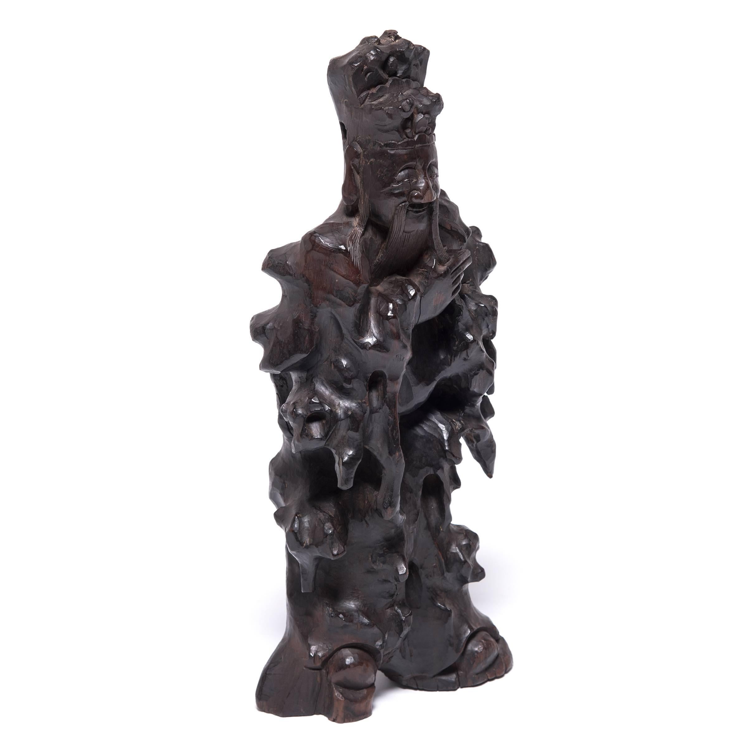 Scholars in China's Qing dynasty often turned to the natural world as inspiration for their musings. These influences are apparent in the brushes, tables, pictures, and inkstones they surrounded themselves with. Root sculptures like this figure are