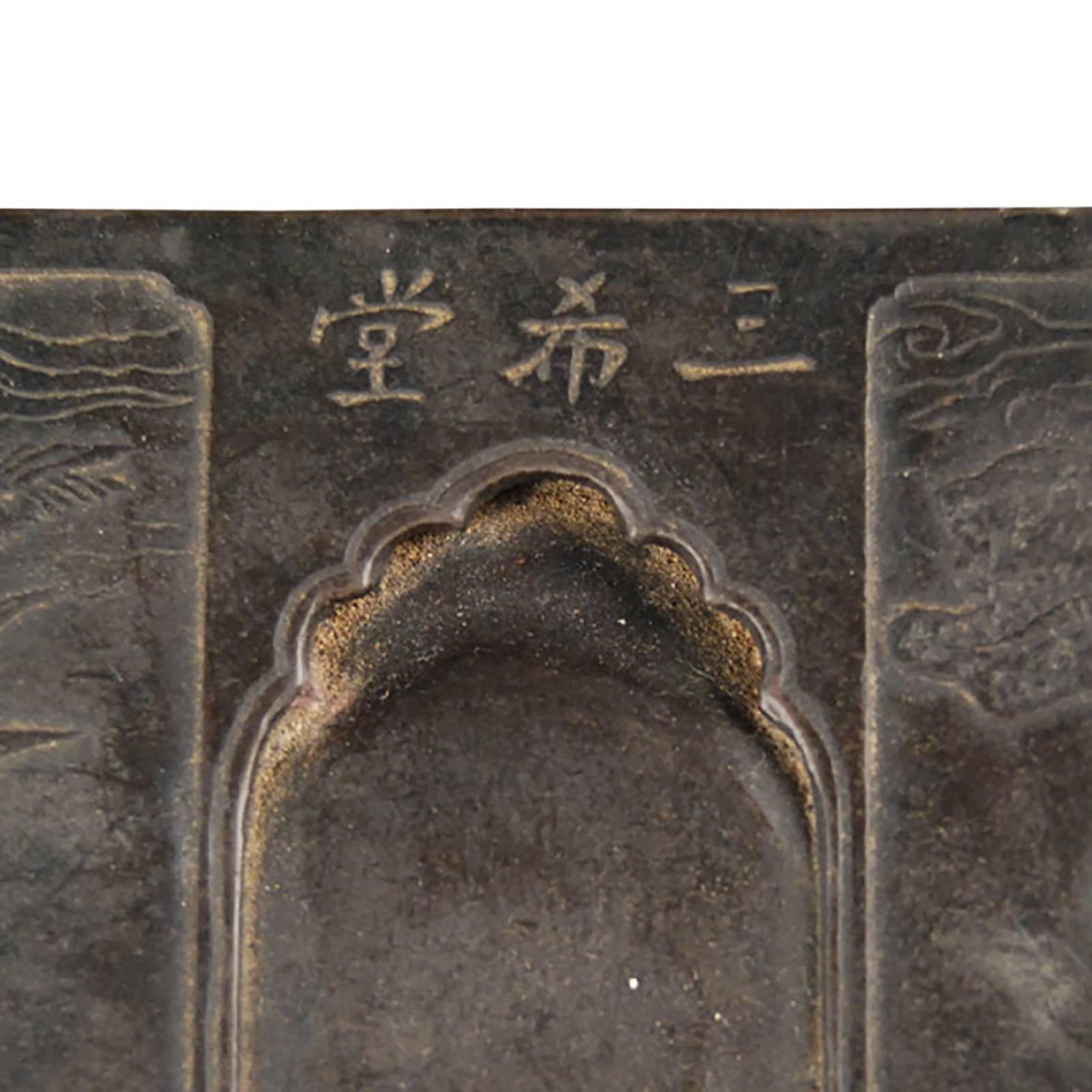 This 19th century footed ink stone was finely carved by hand from a solid block of Duan stone. The right side is carved with birds in flight and the left side with bamboo. A plant symbolizing longevity and modesty.

 