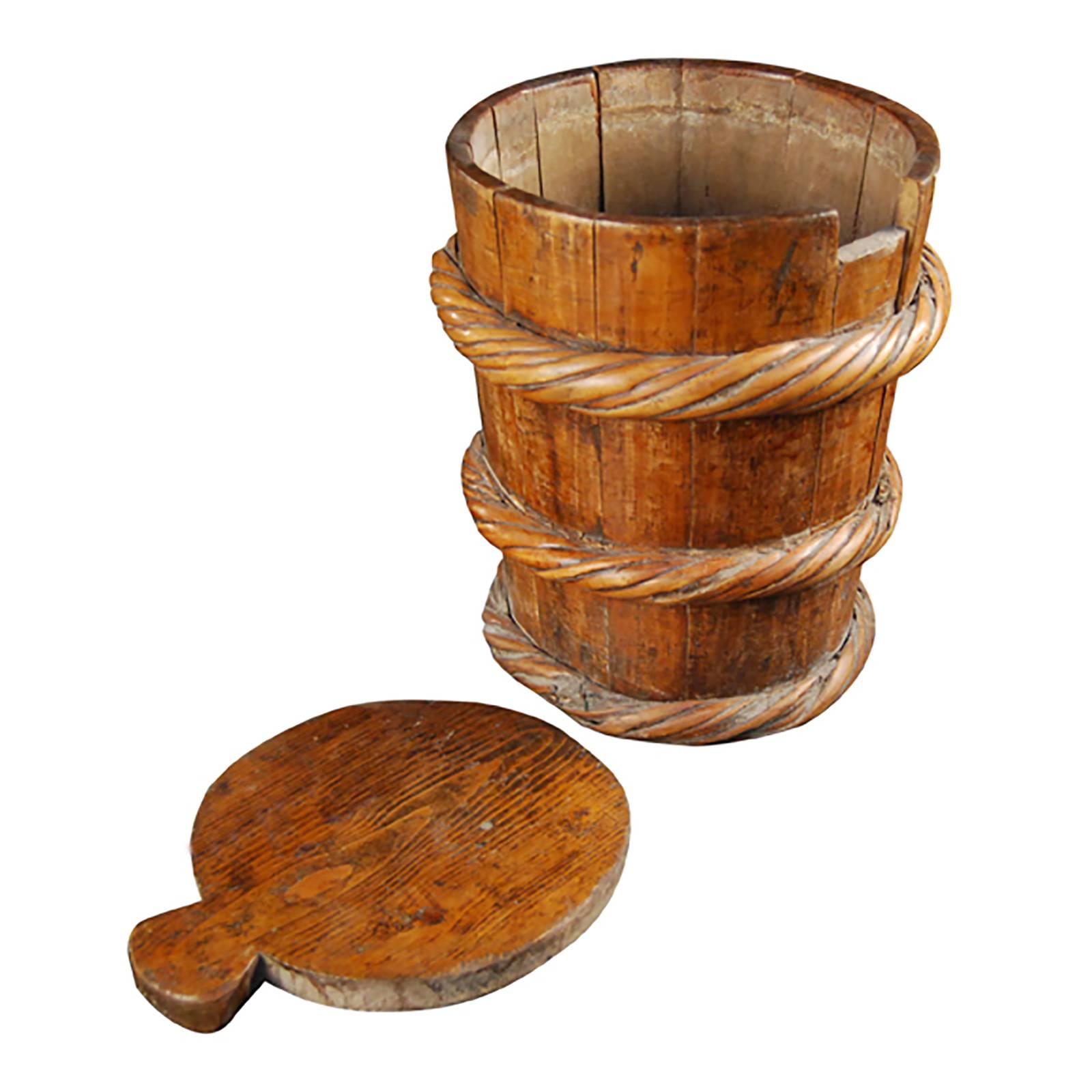 Food was scarce in the Tibetan highlands and had to be carefully rationed, so nothing wasted. This rustic yet well designed container was used over a century ago to transport and store a nutritious butter made from yak’s milk. It is carved out of