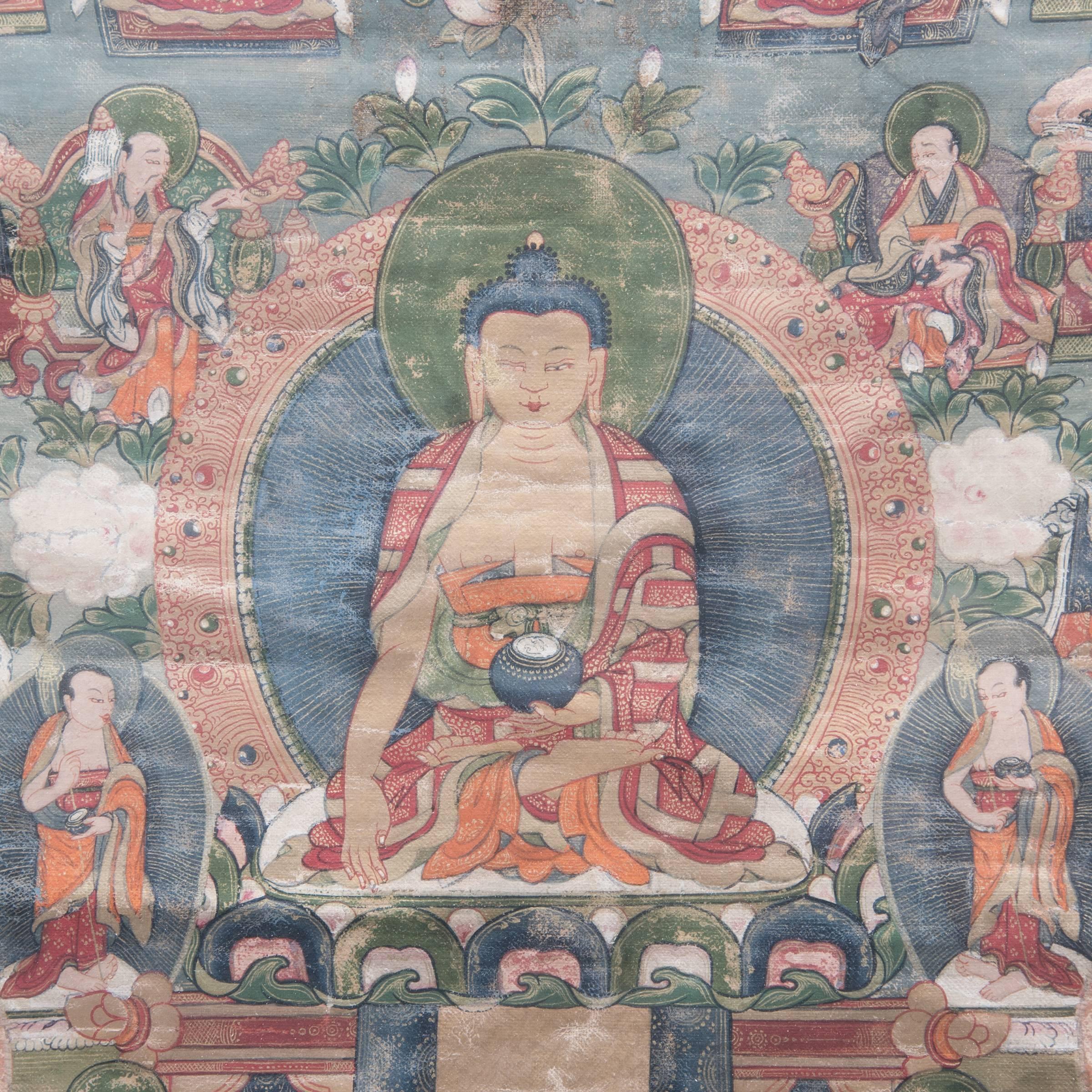 Historically in Buddhist Tibet, patrons and monks commissioned thangka art, or sacred painting, to focus their meditations and prayers. This 19th-century Tibetan Thangka, painted in rich red, green, and blue pigments, still maintains incredible