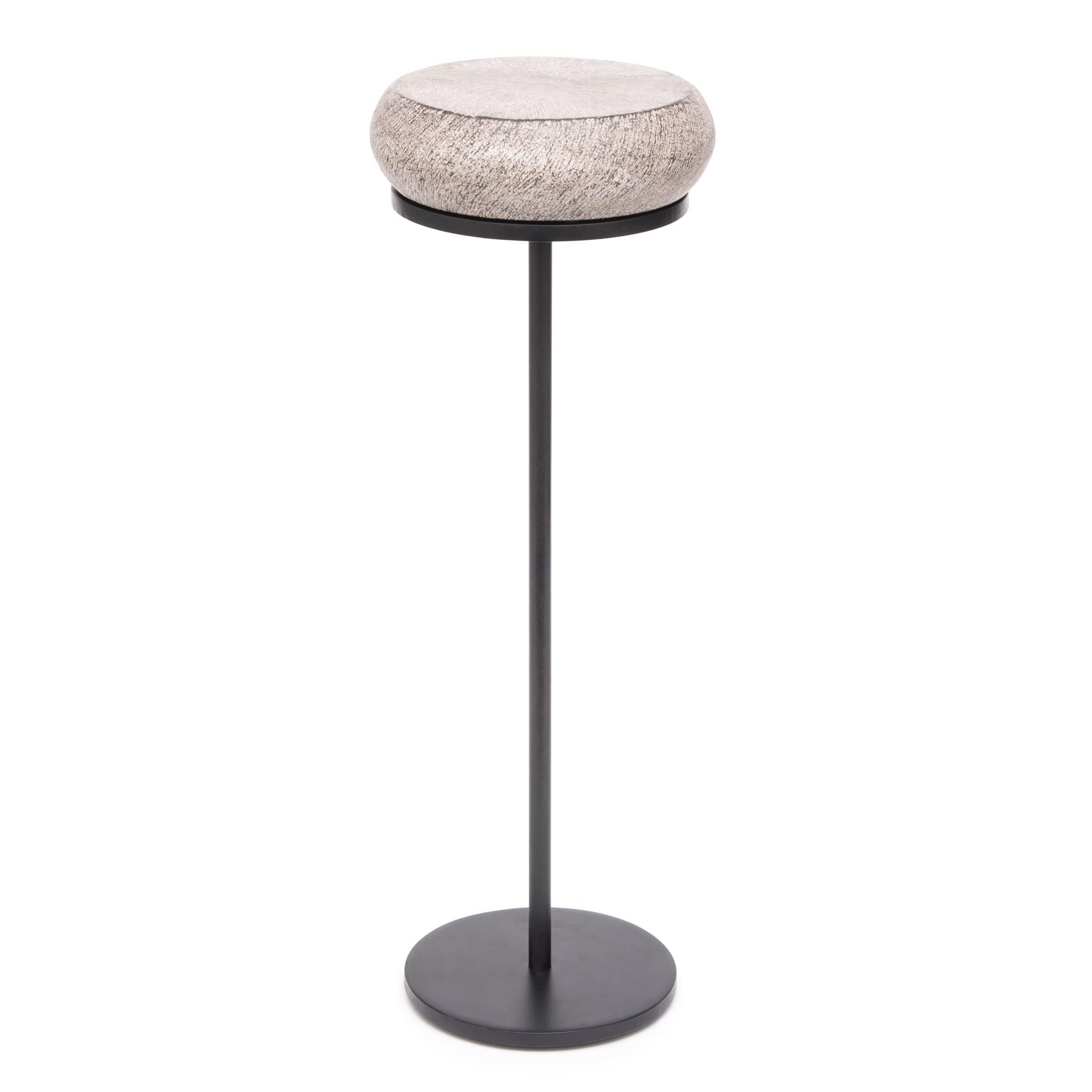Traditional Chinese stone furniture-makers frequently mimicked drums in their carving forms. The shape featured in this petite drum table references a traditional hand held fish drum. In Taoist mythology the fish drum was the symbol of Zhang Guolao,