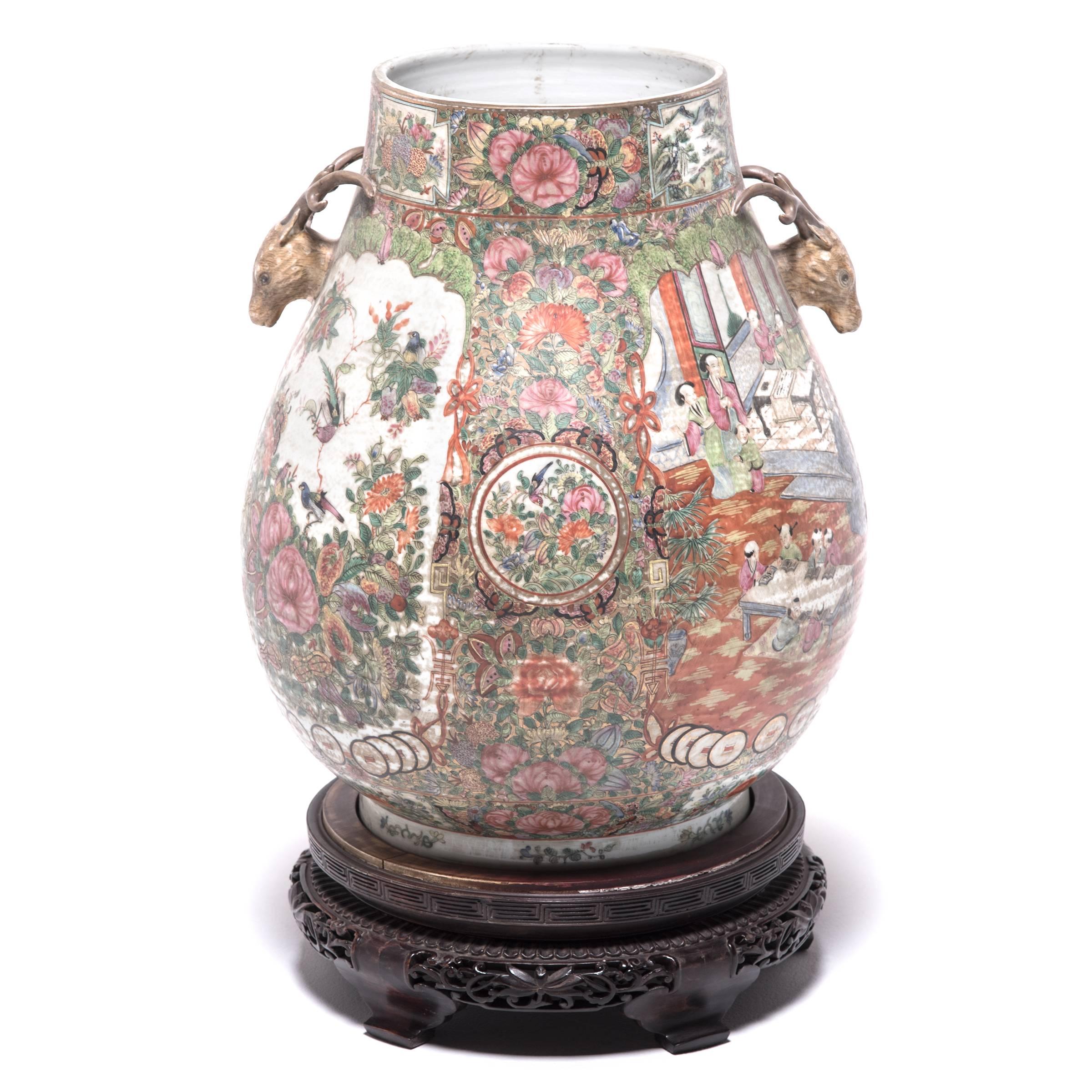 Lavishly detailed and masterfully painted, this pair of vases was acquired from the collection of gentleman who traveled extensively to Shangai in the 1920s. Made in 1900, the monumental hu vases are exquisite examples of the colorful glazes and