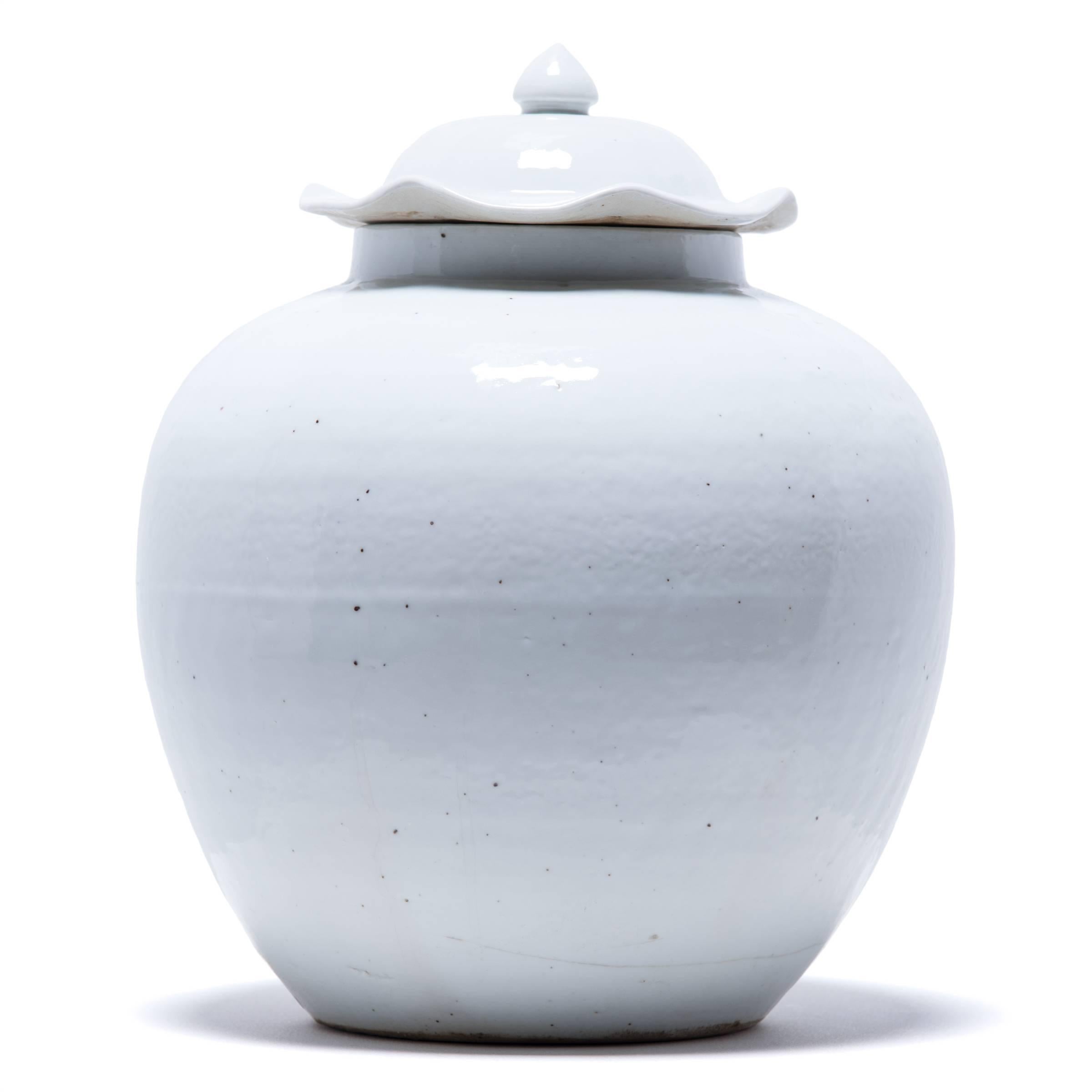 A milky white glaze emphasizes the sculptural form of this contemporary update on a Chinese Classic. Refining the traditional onion shape, the jar’s monochromatic look draws attention to its clean lines and artisanal qualities.

 