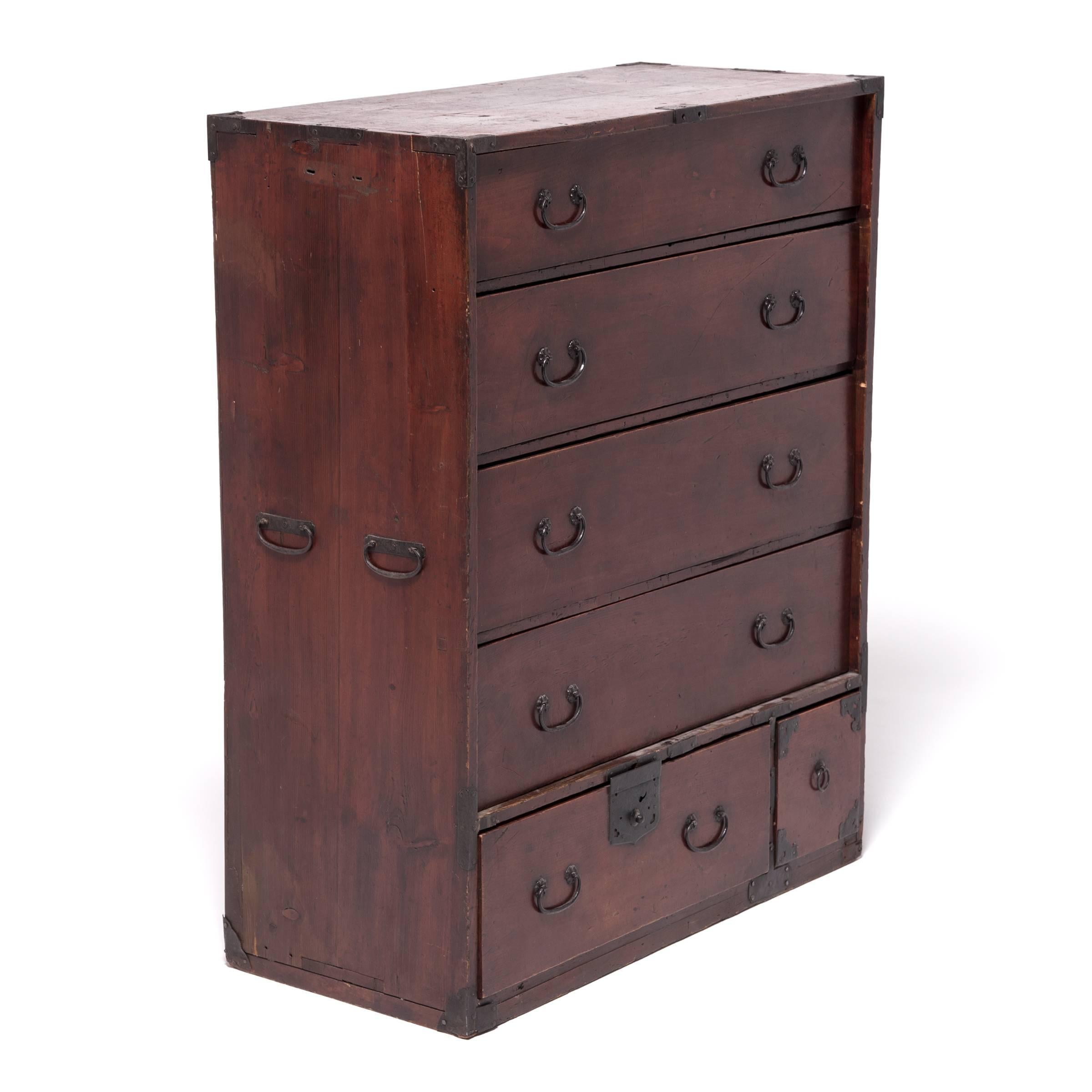 Traditionally designed to be portable and functional, Japanese tansu chests were versatile storage cabinets used for all kinds of purposes. This chest of drawers was originally used to store kimono. Made during Japan’s Mejii period (1868–1912),