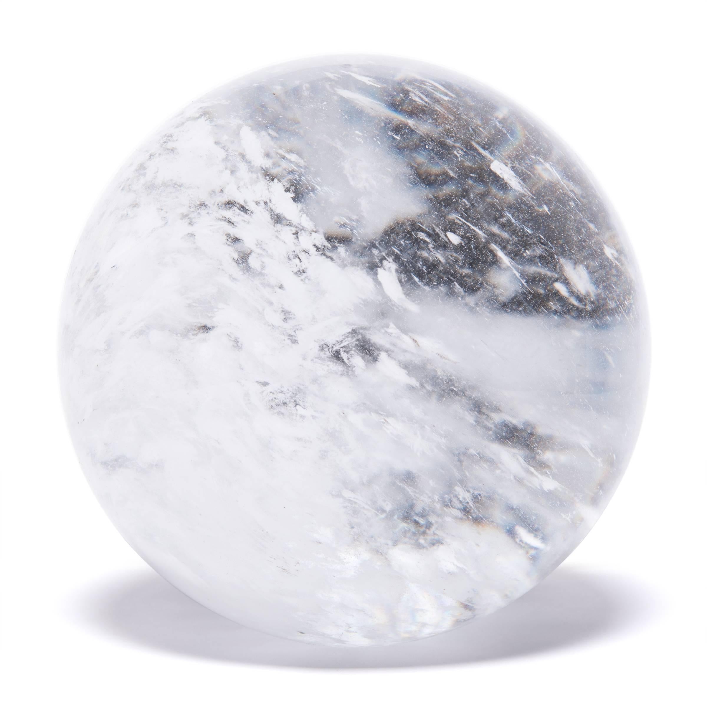 Gem lore is endless, and every culture has its own beliefs about specific stones tied to cultural history, geography, and spiritual practices. In China, some practitioners of Feng Shui value clear quartz, like this beautiful crystal ball, for its