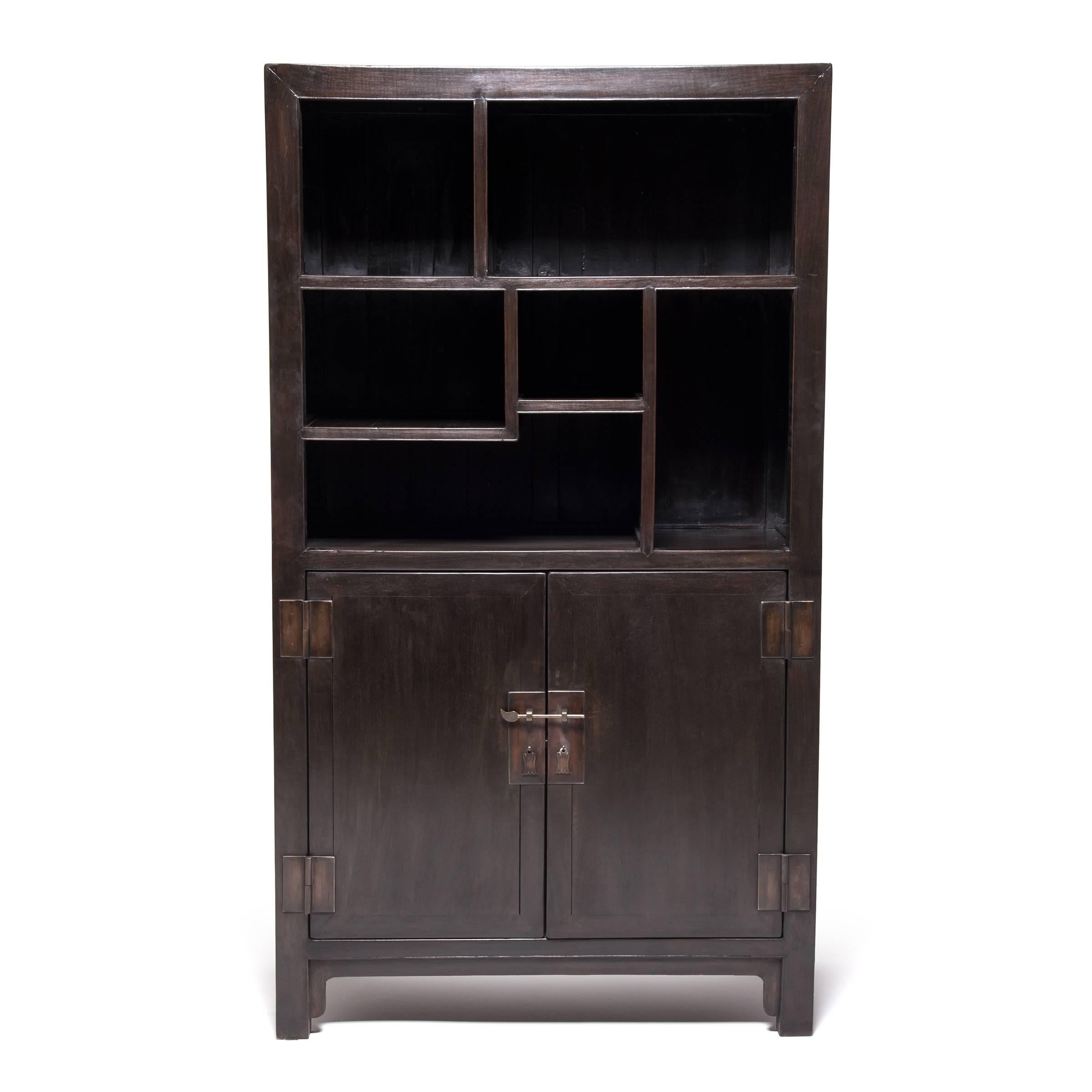 This pair of antique bookcases looks surprisingly contemporary with its asymmetrical shelves and clean-lined design. Likely centrepieces in the studio of a 20th century Chinese scholar, the elegant bookcases would have showcased books, scrolls,