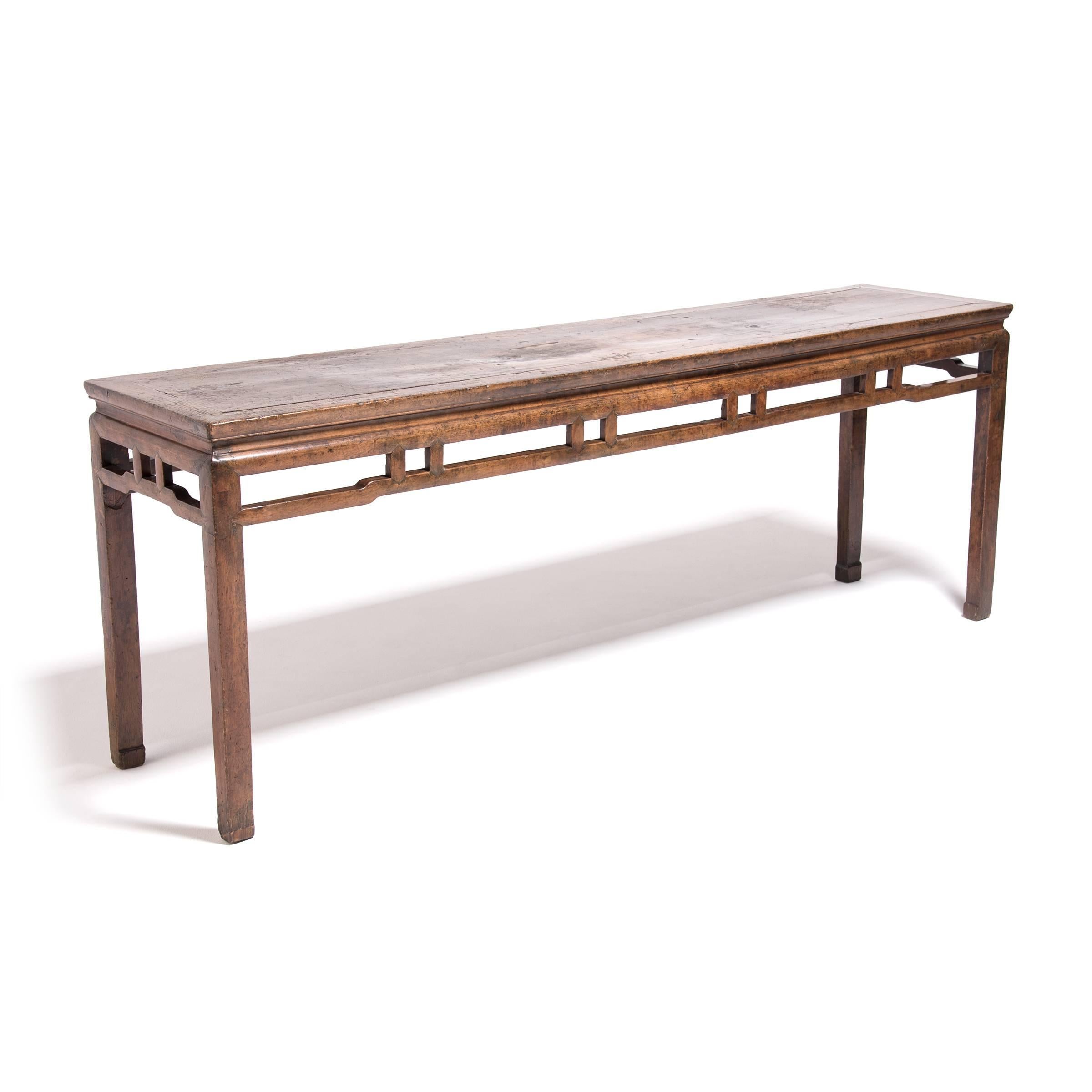 Readily available and durable, the northern elmwood used to make this 19th-century altar table has an even grain and color that enabled artisans to employ sophisticated joinery, piecing the table together without benefit of glue or nails. This