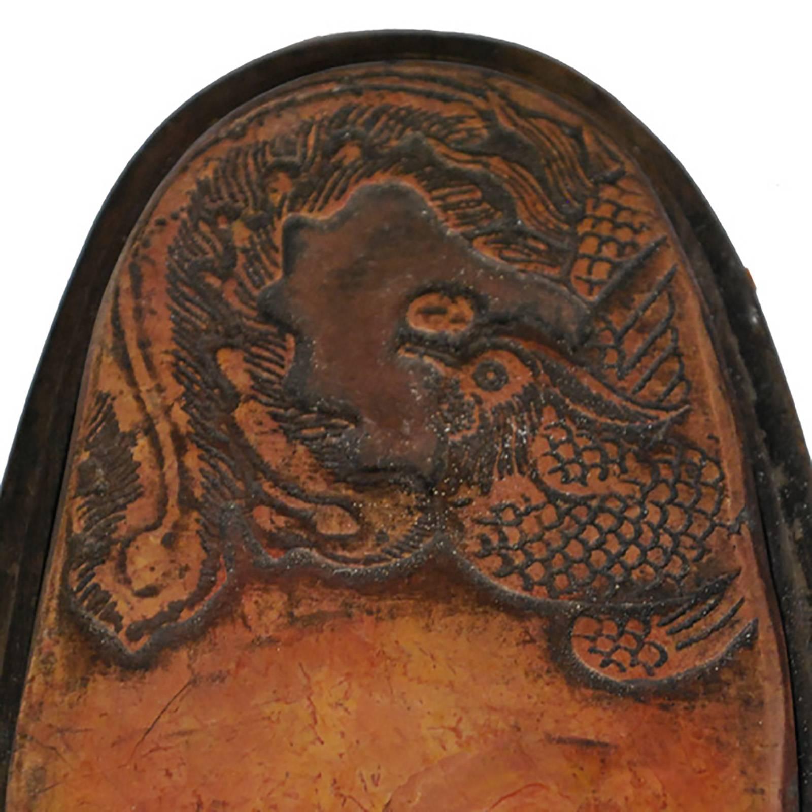 Functionally used as a surface to mix dry ink and water for calligraphy, this inkstone was also an object revered for its symbolism. The phoenix, known as “the king of birds” in Chinese mythology, only appears in times of peace and prosperity and