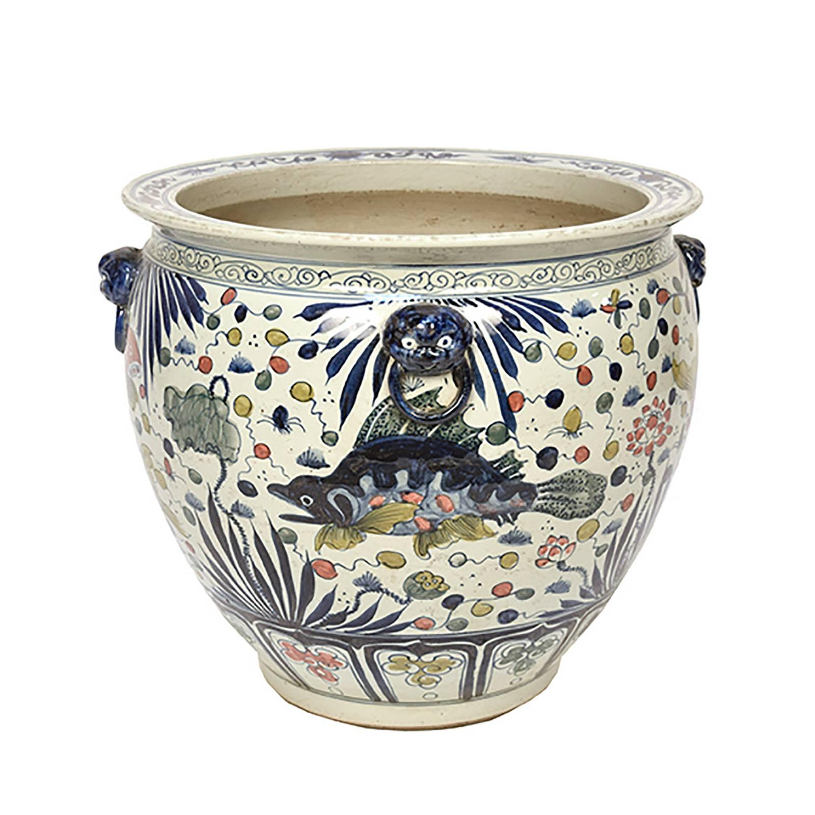The painterly fish and flora of the sea on this basin are traditional symbols of prosperity and harmony. This vessel deviates from others in our collection with its spectrum of color and paired fish. Double fish represent unity and fidelity in